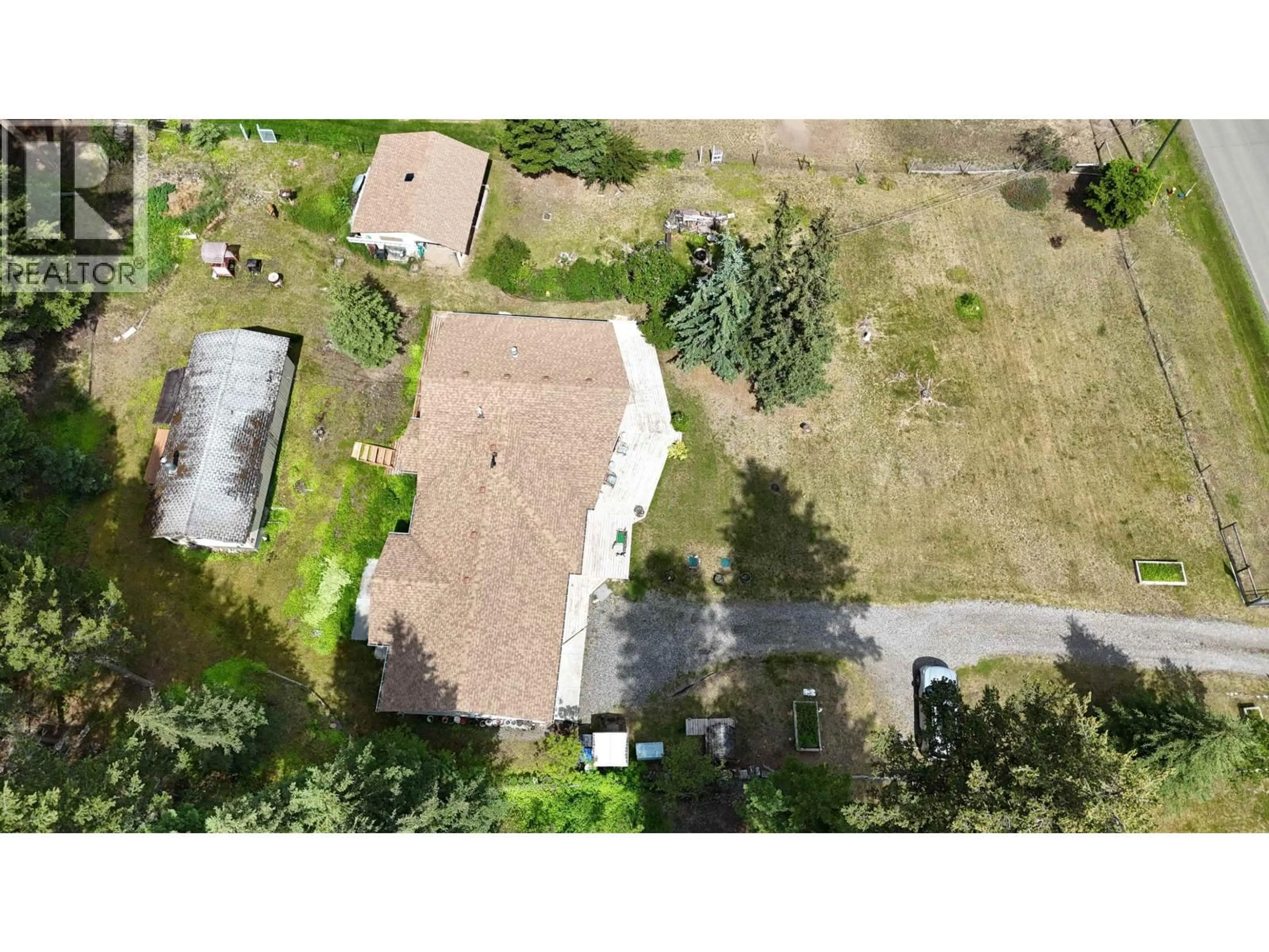 A pic from outside/outdoor area/front of a property/back of a property/a pic from drone, street for 5328 KALLUM DRIVE, 108 Mile Ranch British Columbia V0K2Z0