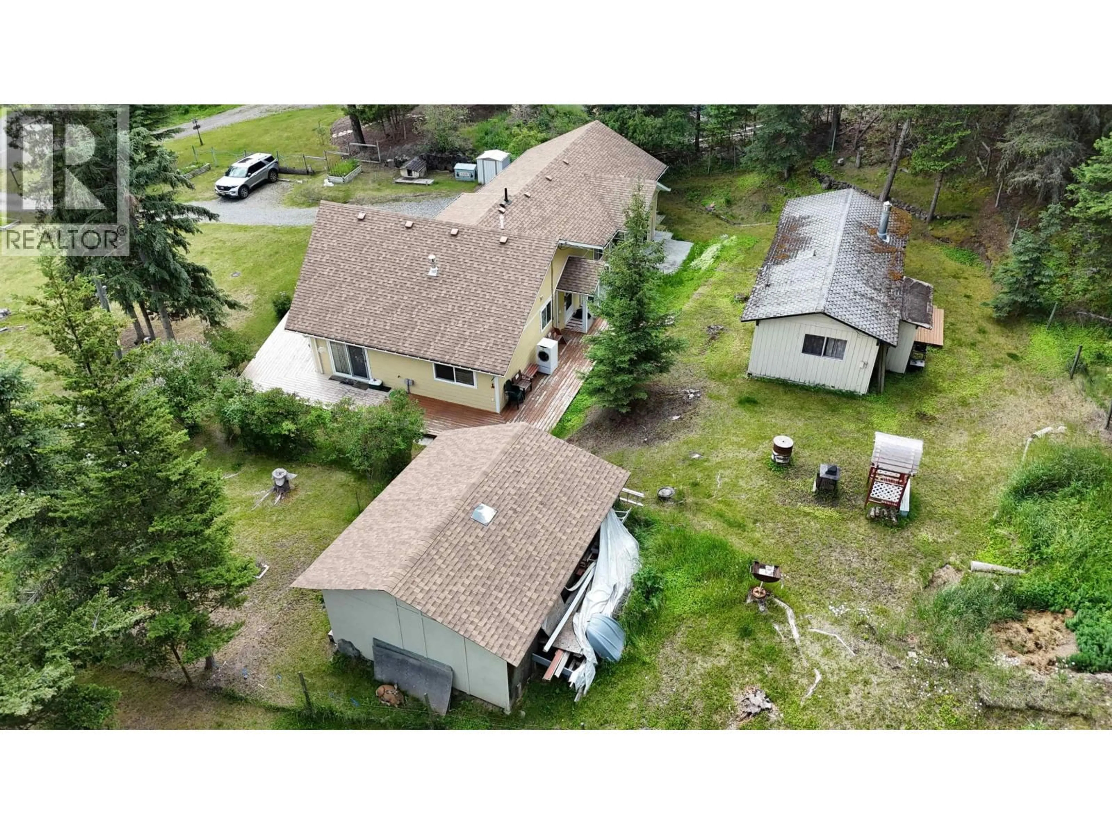 A pic from outside/outdoor area/front of a property/back of a property/a pic from drone, building for 5328 KALLUM DRIVE, 108 Mile Ranch British Columbia V0K2Z0