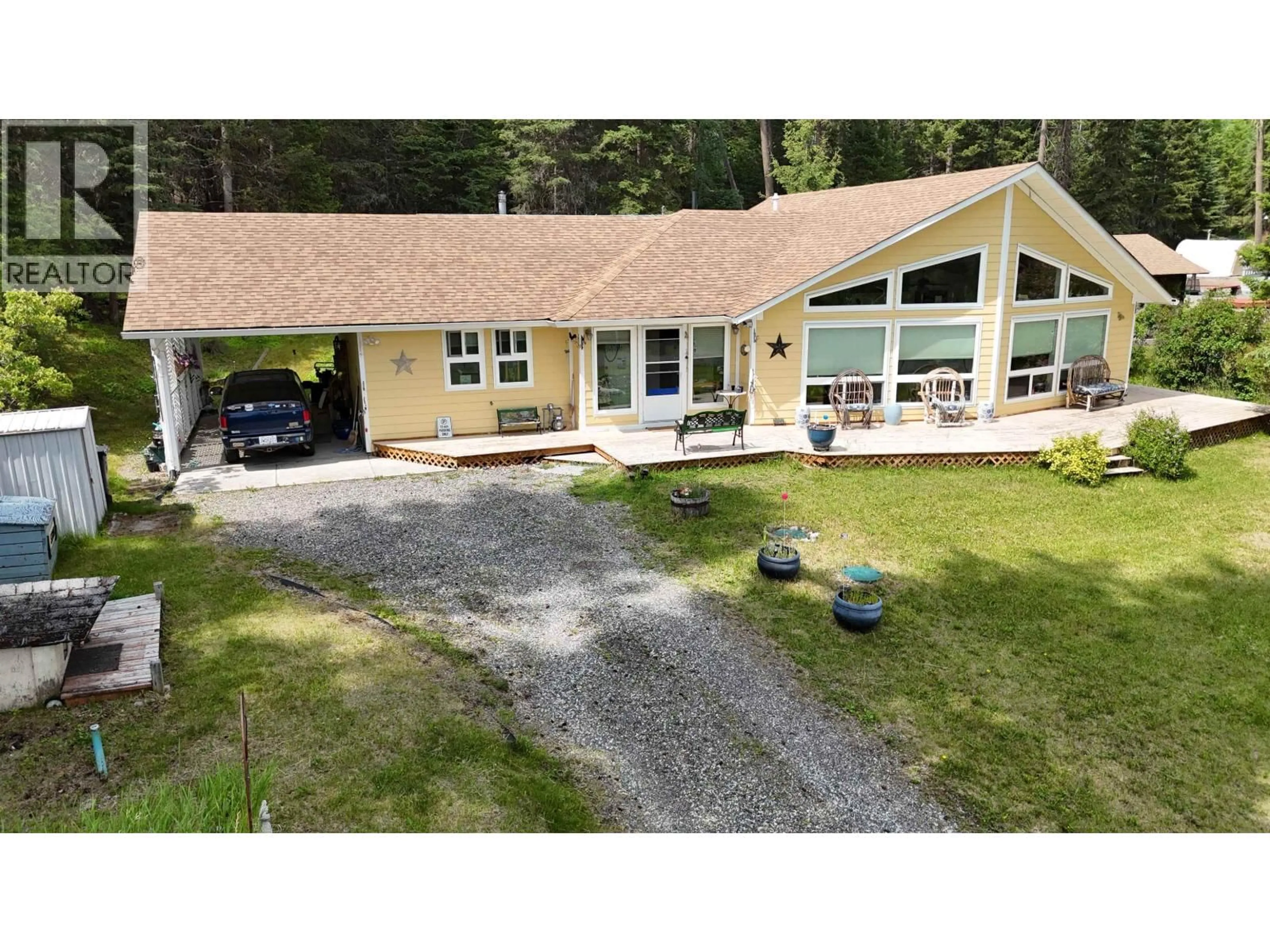 A pic from outside/outdoor area/front of a property/back of a property/a pic from drone, unknown for 5328 KALLUM DRIVE, 108 Mile Ranch British Columbia V0K2Z0