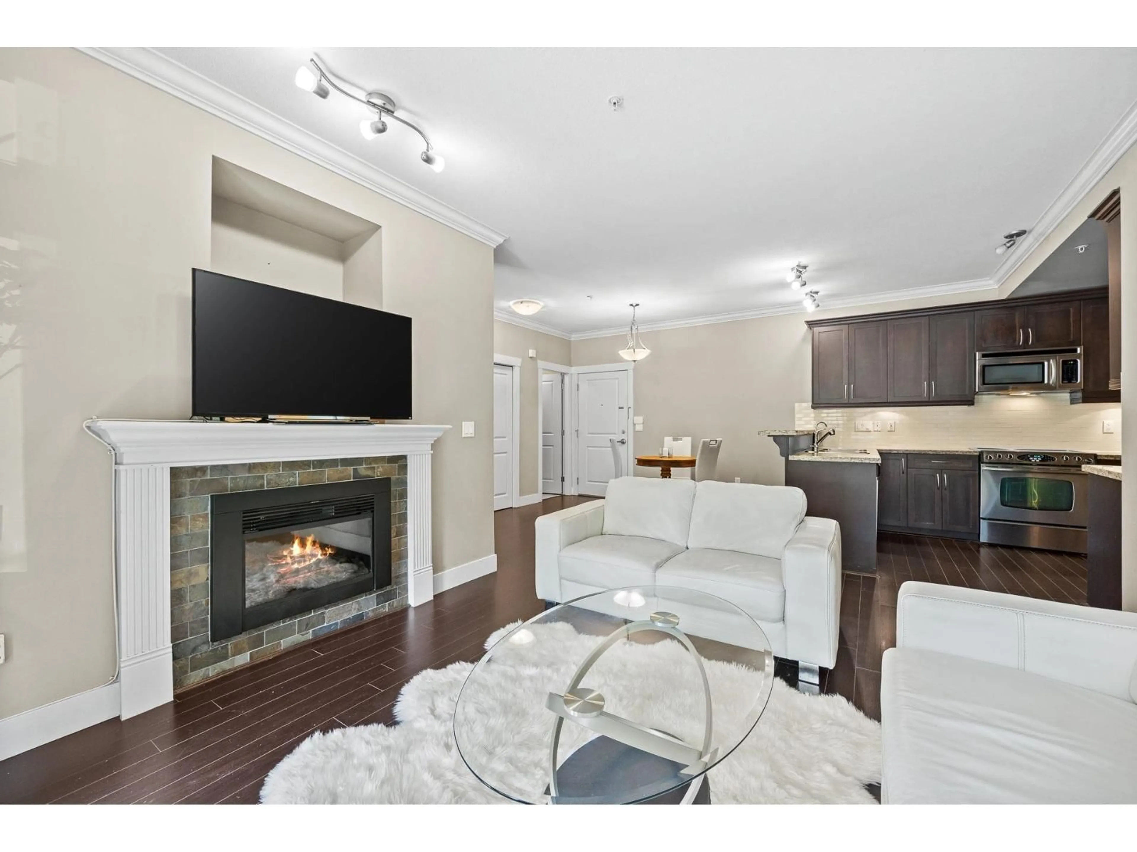 Living room with furniture, wood/laminate floor for 103 - 15368 17A, Surrey British Columbia V4A1V3