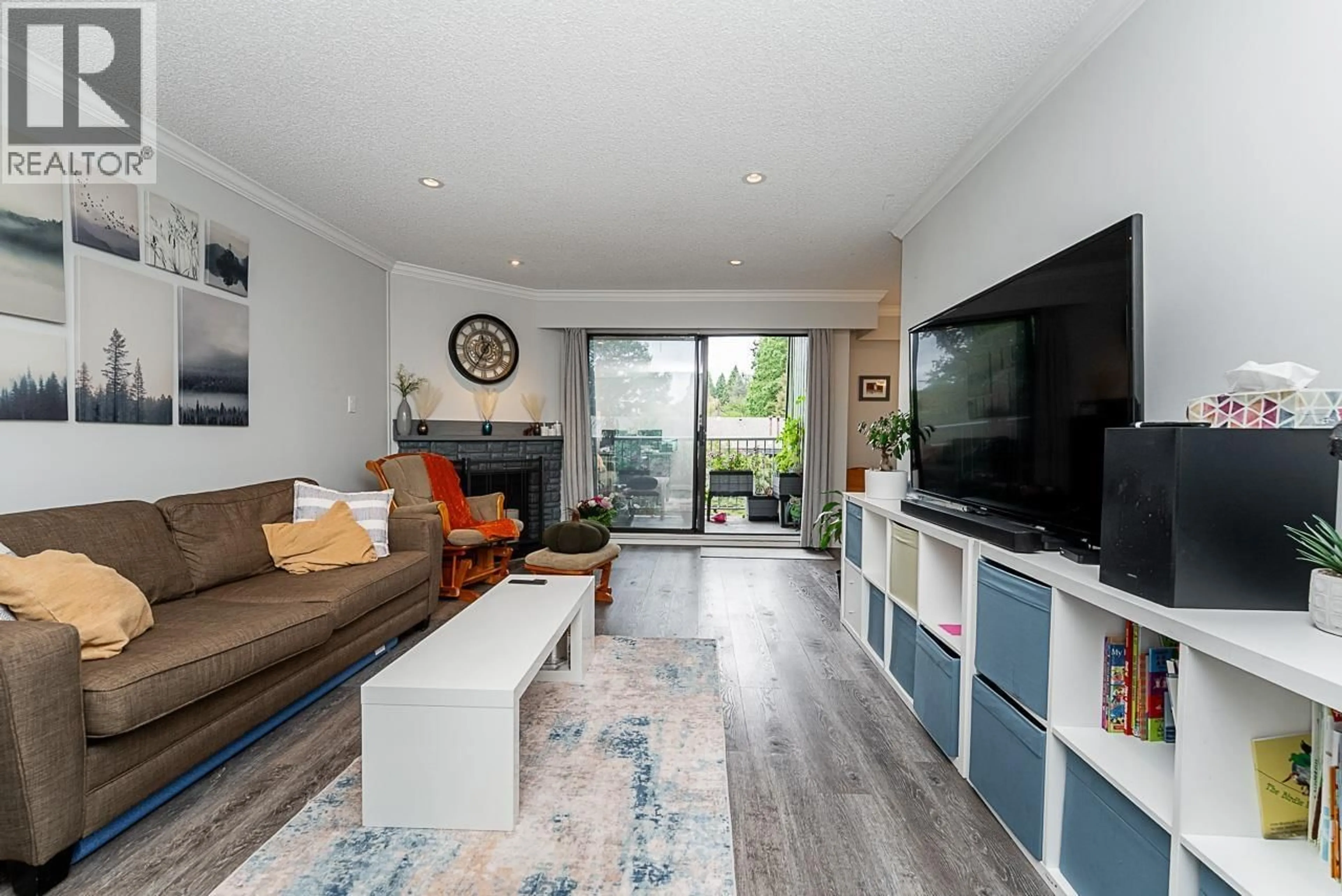Living room with furniture, wood/laminate floor for 217 - 9202 HORNE STREET, Burnaby British Columbia V3N4K2