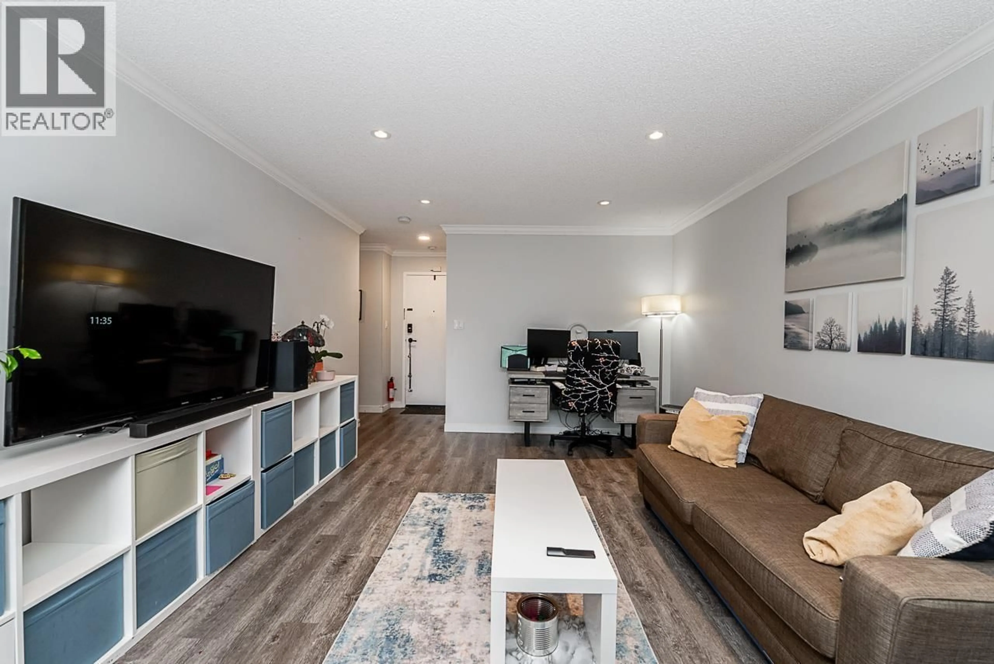 Living room with furniture, wood/laminate floor for 217 - 9202 HORNE STREET, Burnaby British Columbia V3N4K2