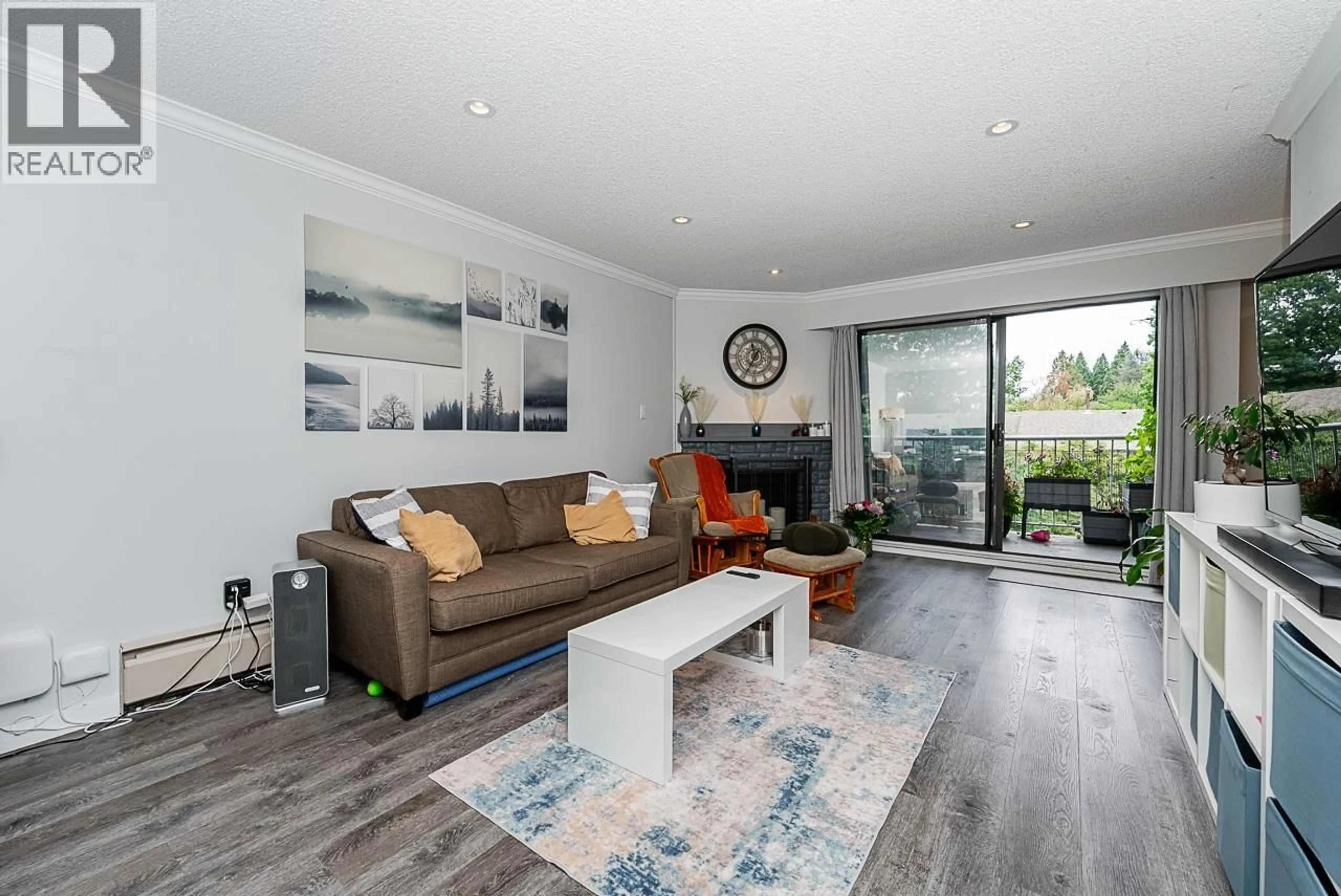 Living room with furniture, wood/laminate floor for 217 - 9202 HORNE STREET, Burnaby British Columbia V3N4K2