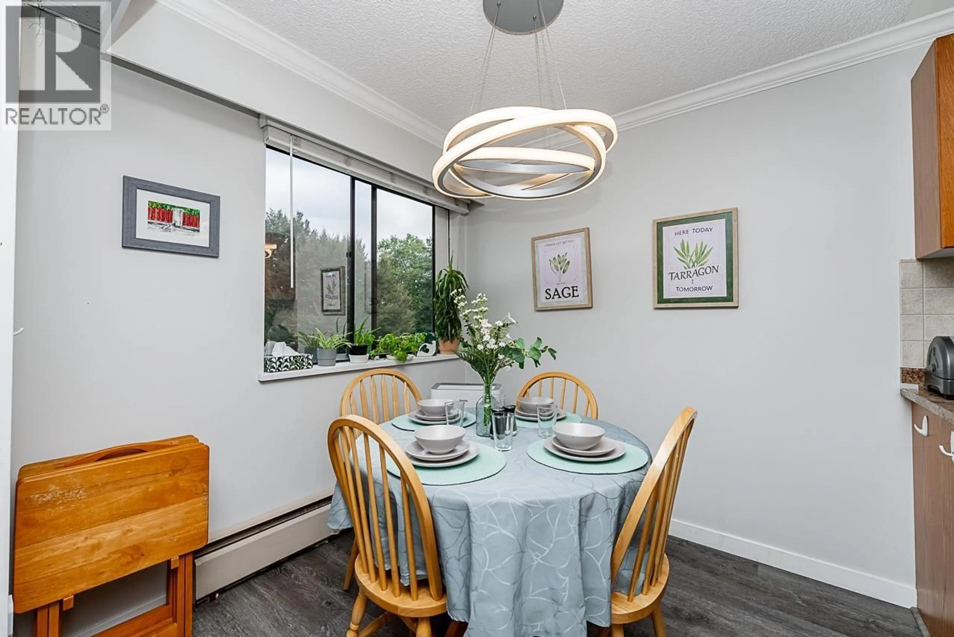 Dining room, wood/laminate floor for 217 - 9202 HORNE STREET, Burnaby British Columbia V3N4K2