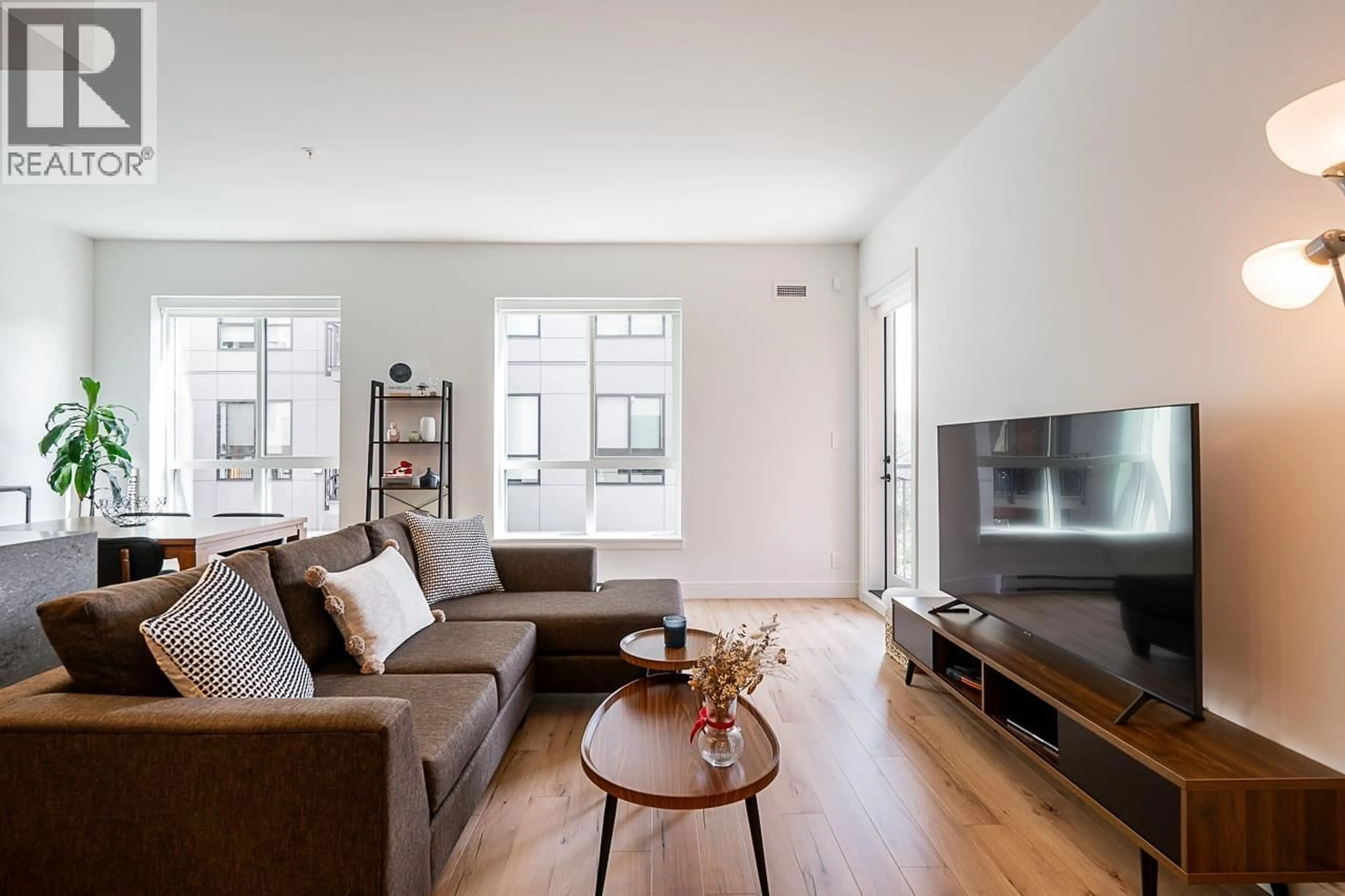 Living room with furniture, wood/laminate floor for 435 - 55 KLAHANIE DRIVE, Port Moody British Columbia V3H0M9