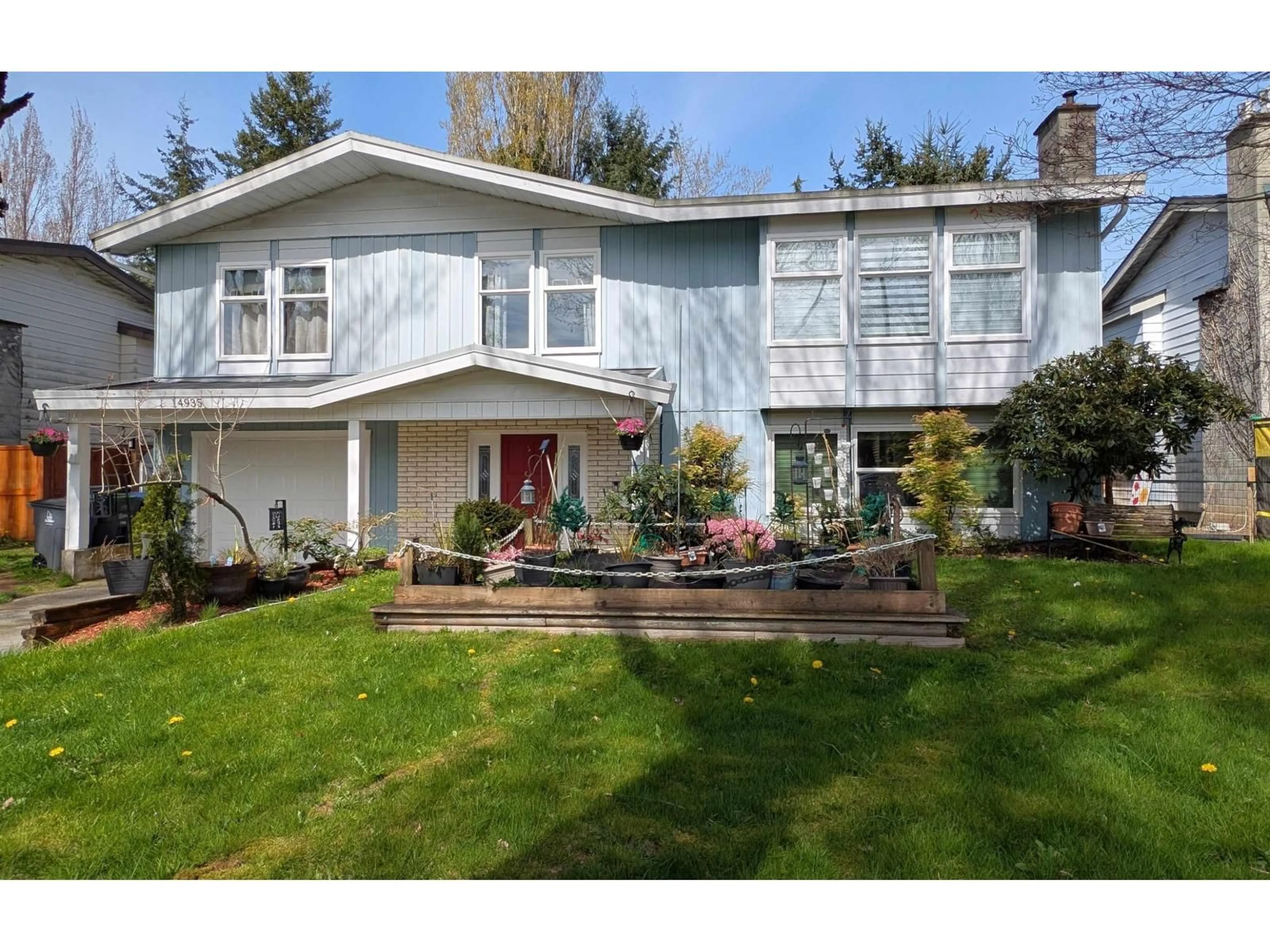Home with vinyl exterior material, street for 14935 92A, Surrey British Columbia V3R7A3