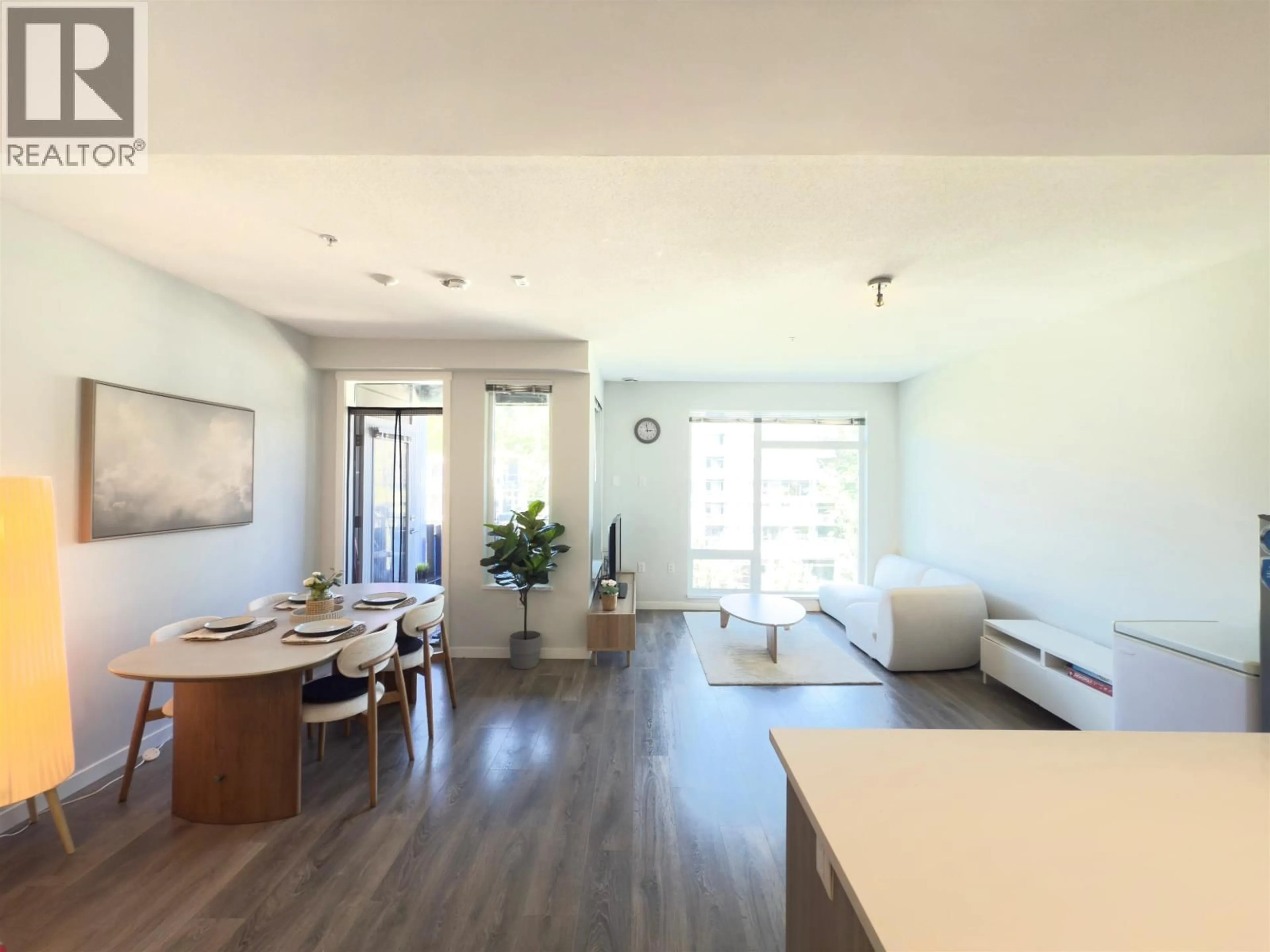 Living room with furniture, wood/laminate floor for 510 - 3289 RIVERWALK AVENUE, Vancouver British Columbia V5S0G2