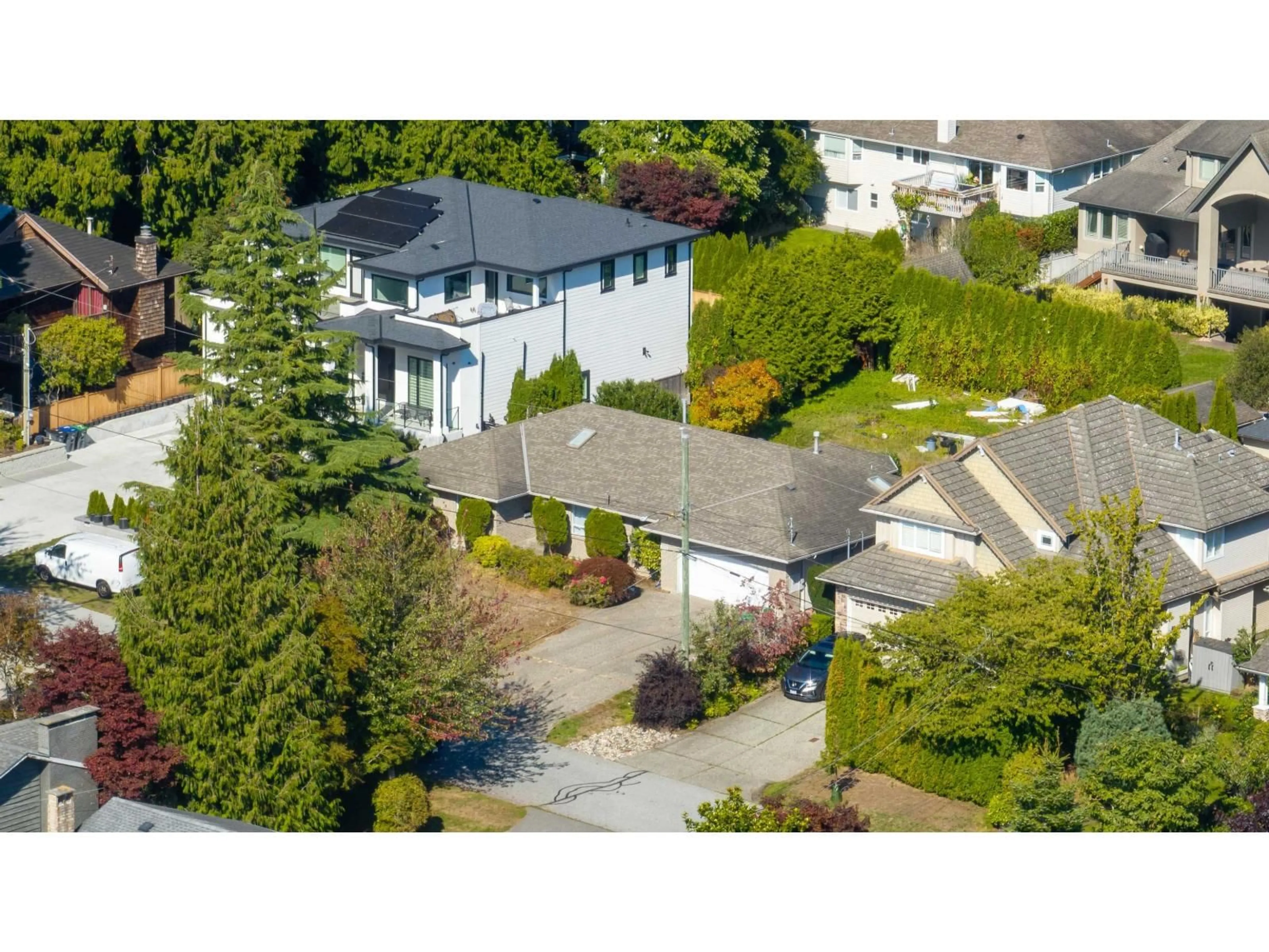 A pic from outside/outdoor area/front of a property/back of a property/a pic from drone, street for 13139 14, Surrey British Columbia V4A1G6