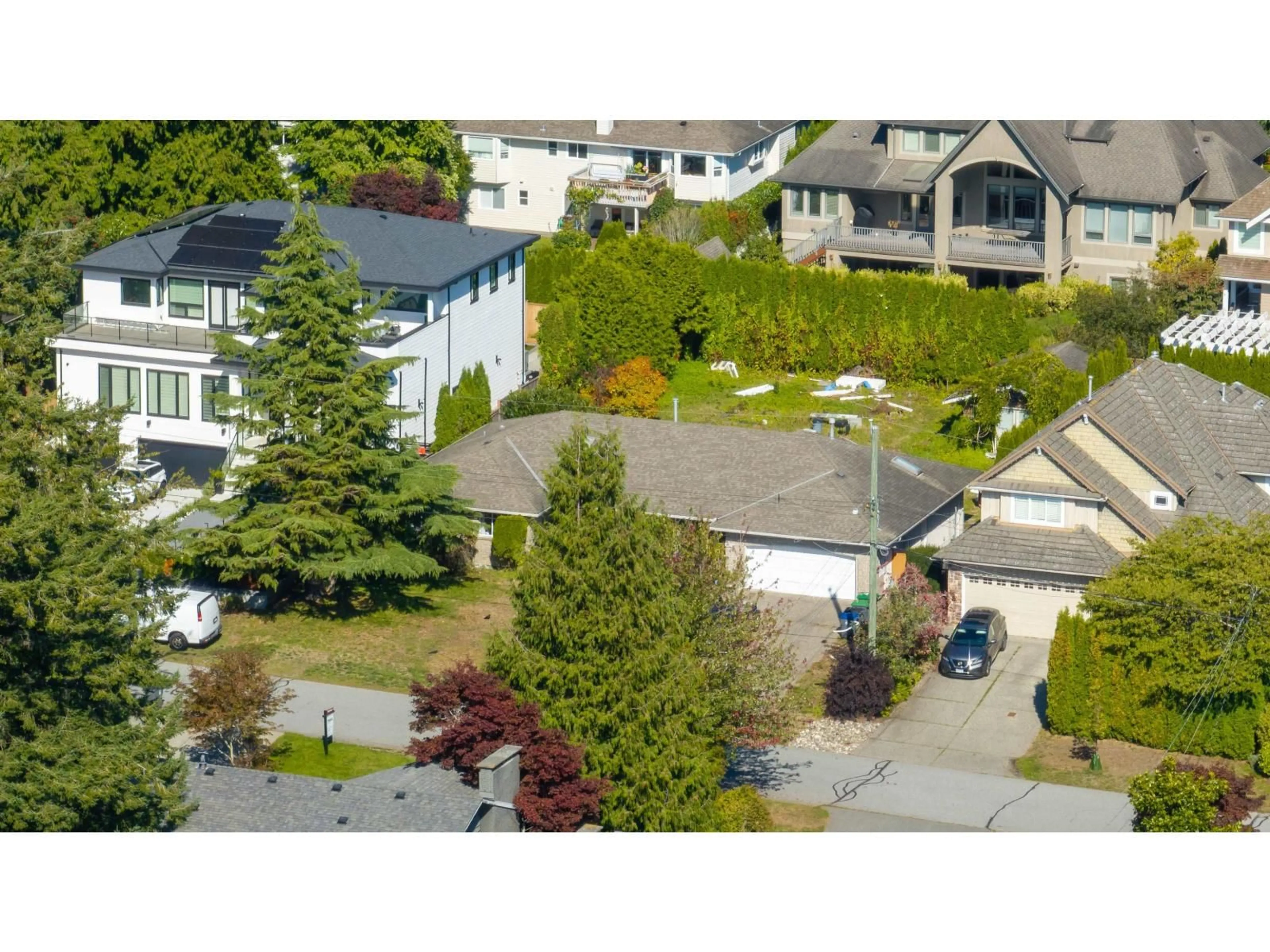 A pic from outside/outdoor area/front of a property/back of a property/a pic from drone, street for 13139 14, Surrey British Columbia V4A1G6