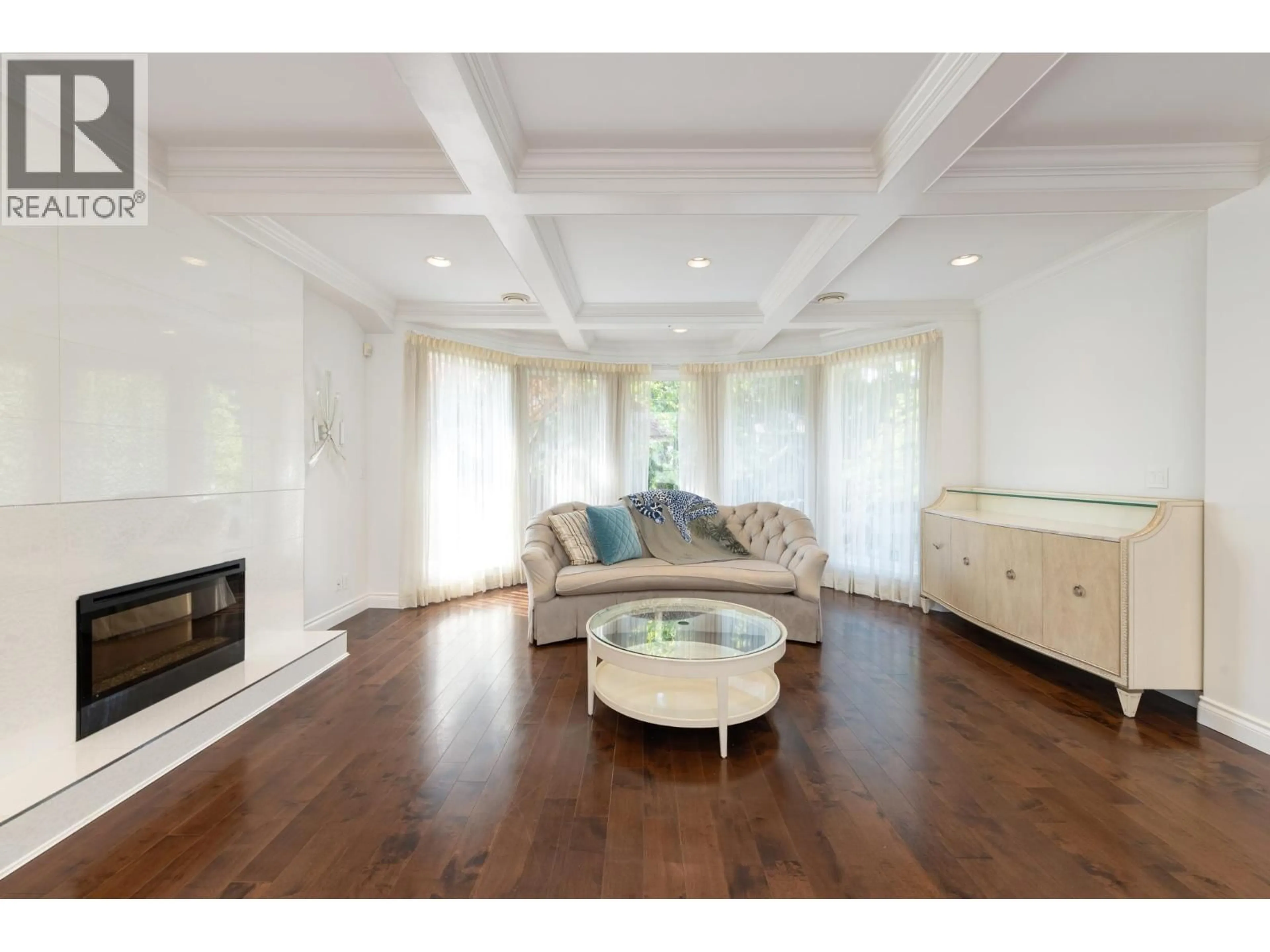 Living room with furniture, wood/laminate floor for 6488 WILTSHIRE STREET, Vancouver British Columbia V6M3M4