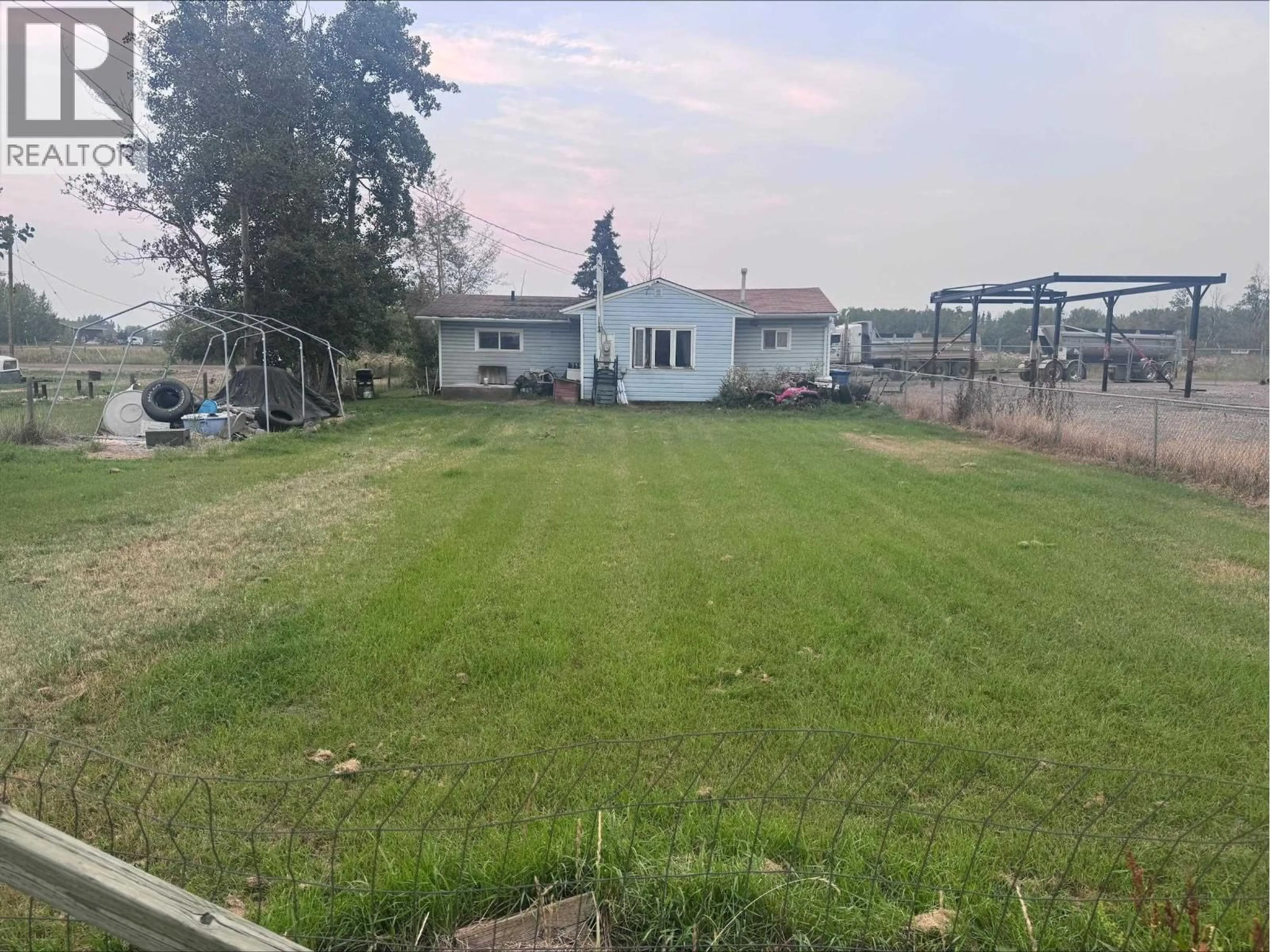 A pic from outside/outdoor area/front of a property/back of a property/a pic from drone, unknown for 8135 101 AVENUE, Fort St. John British Columbia V1J2A2