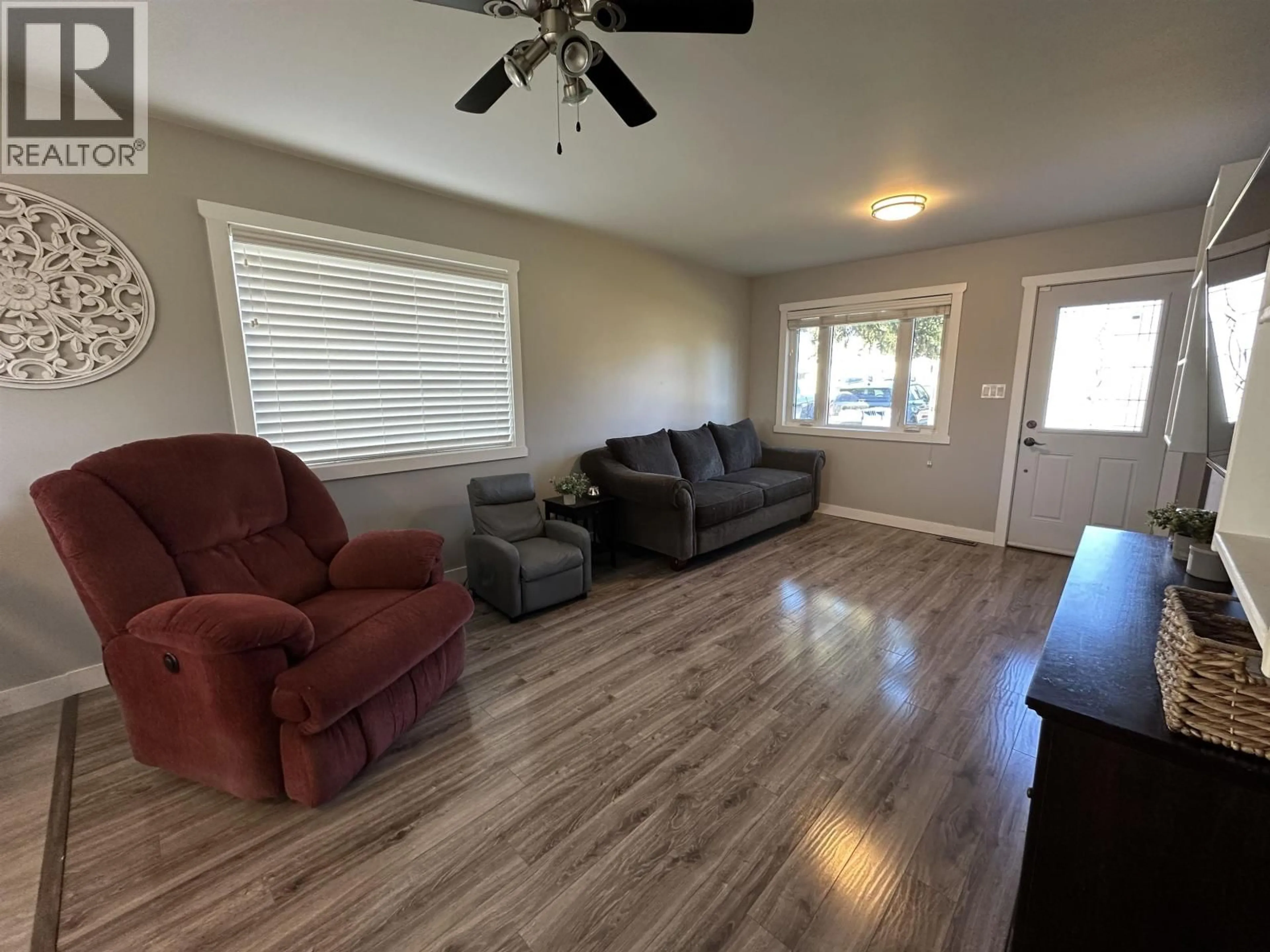 Living room with furniture, wood/laminate floor for 9615 97 AVENUE, Fort St. John British Columbia V1J1N2