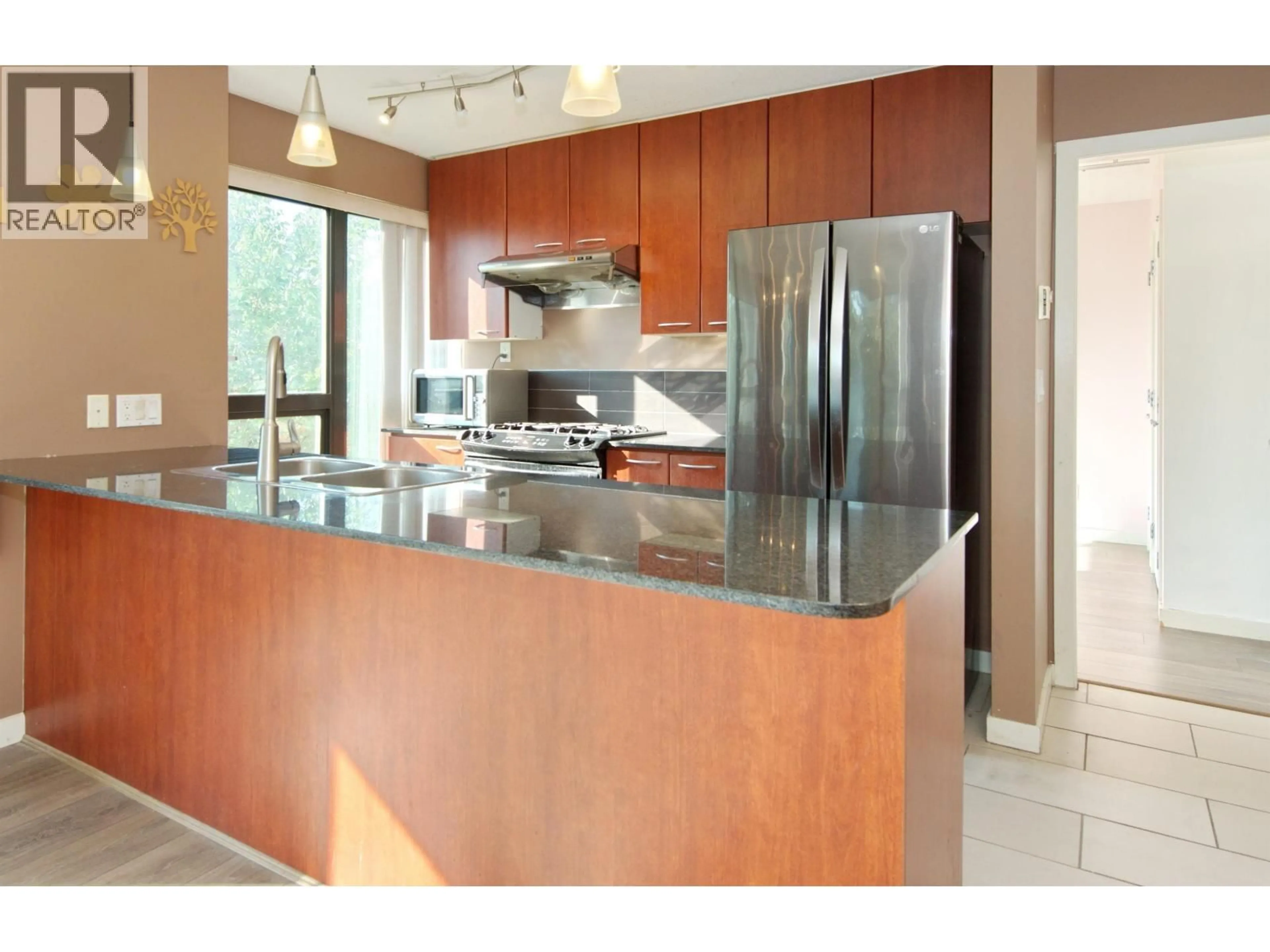 Open concept kitchen, ceramic/tile floor for 202 - 7108 COLLIER STREET, Burnaby British Columbia V5E0A1