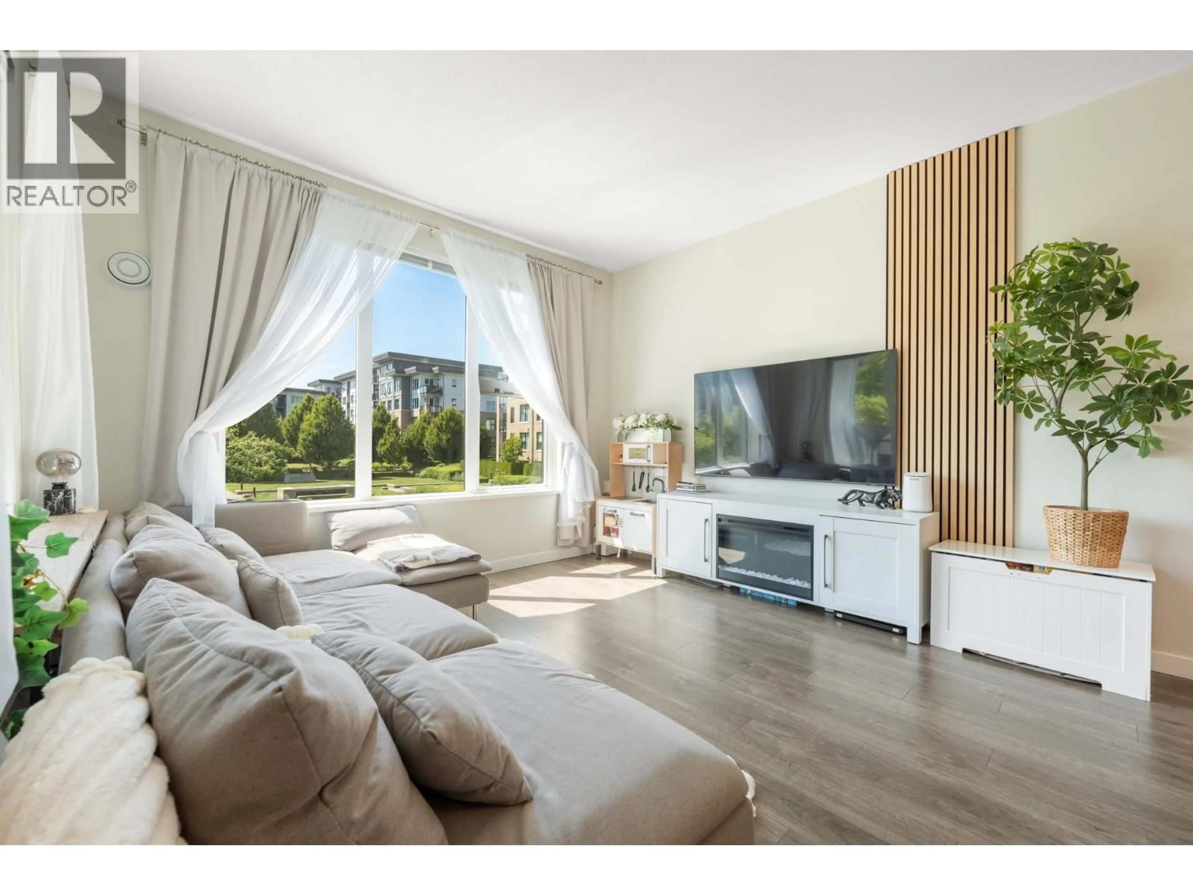 Living room with furniture, wood/laminate floor for 215 - 9388 TOMICKI AVENUE, Richmond British Columbia V6X0P1