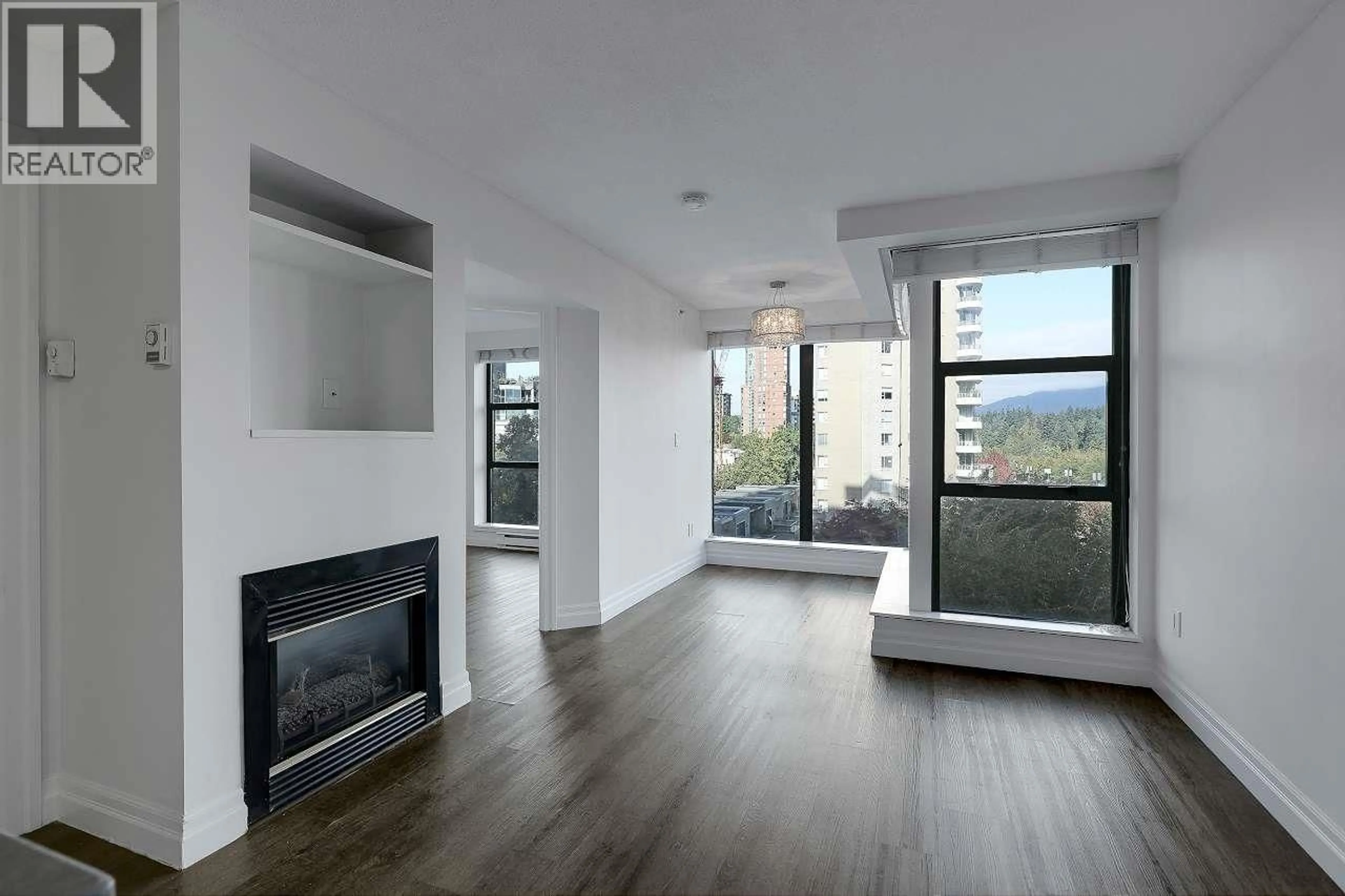 Living room with furniture, wood/laminate floor for 605 - 1723 ALBERNI STREET, Vancouver British Columbia V6G3G9