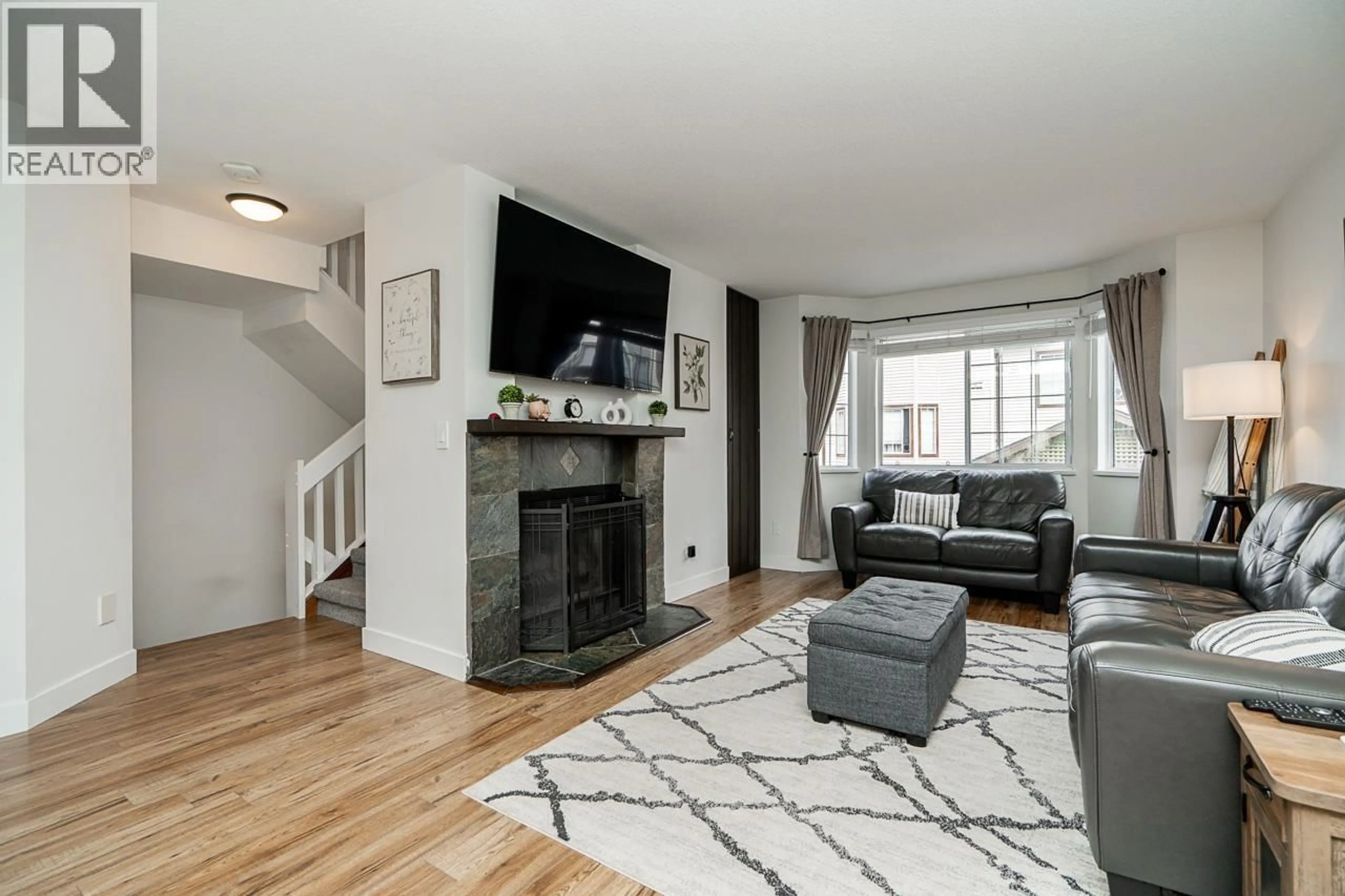Living room with furniture, unknown for 14 - 2352 PITT RIVER ROAD, Port Coquitlam British Columbia V3C5Y2