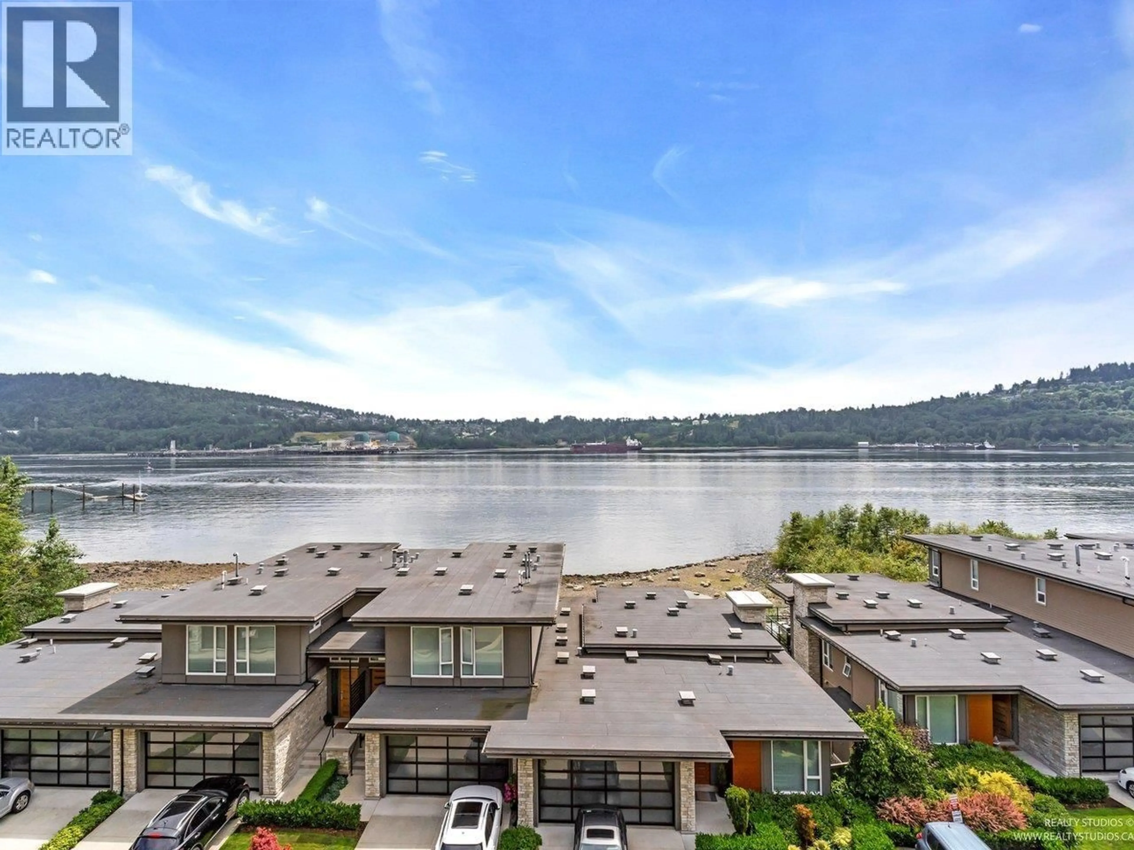 A pic from outside/outdoor area/front of a property/back of a property/a pic from drone, water/lake/river/ocean view for 401 - 3911 CATES LANDING WAY, North Vancouver British Columbia V7G0A6