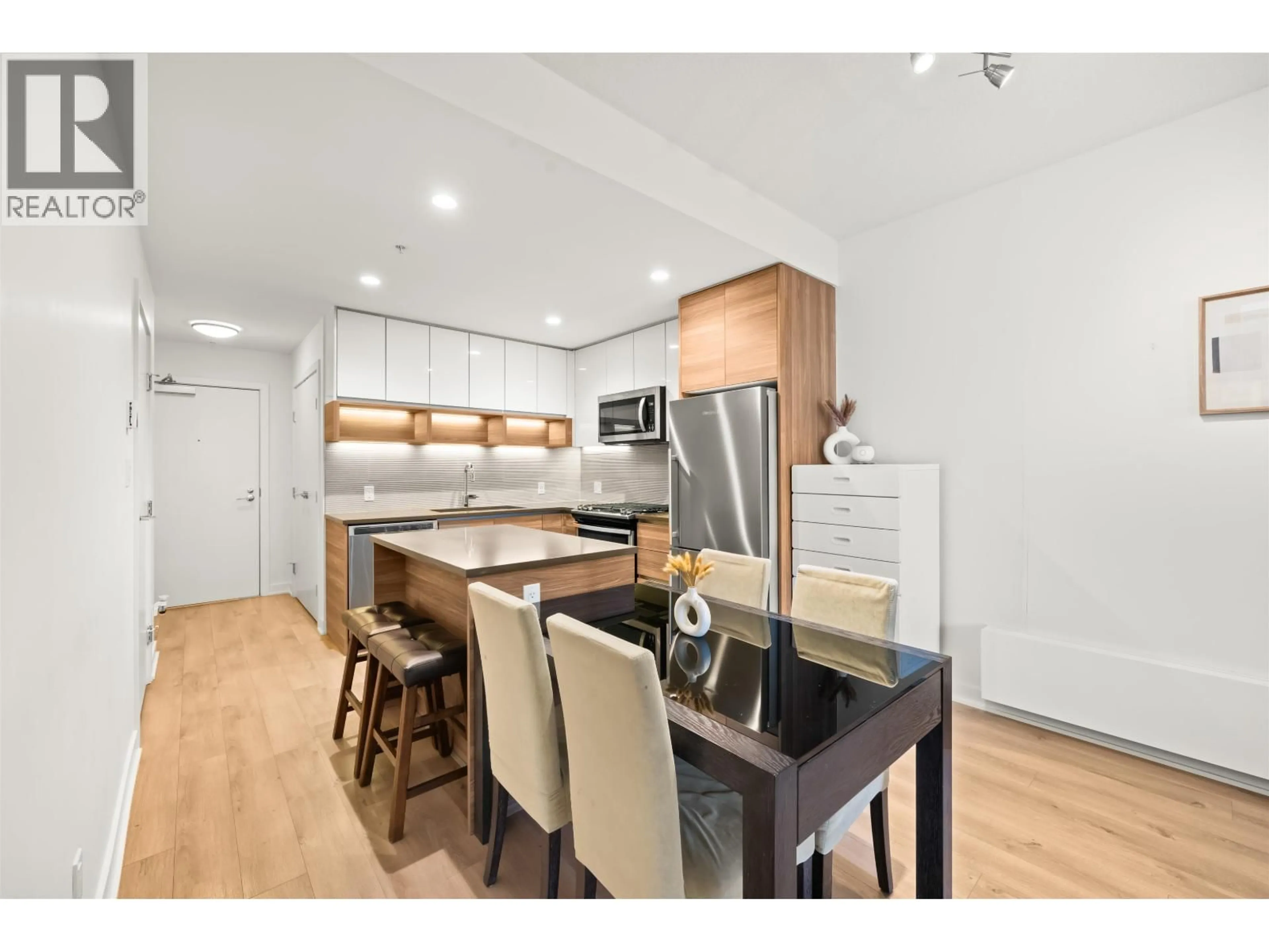 Open concept kitchen, wood/laminate floor for 207 - 8850 UNIVERSITY CRESCENT, Burnaby British Columbia V5A0C8
