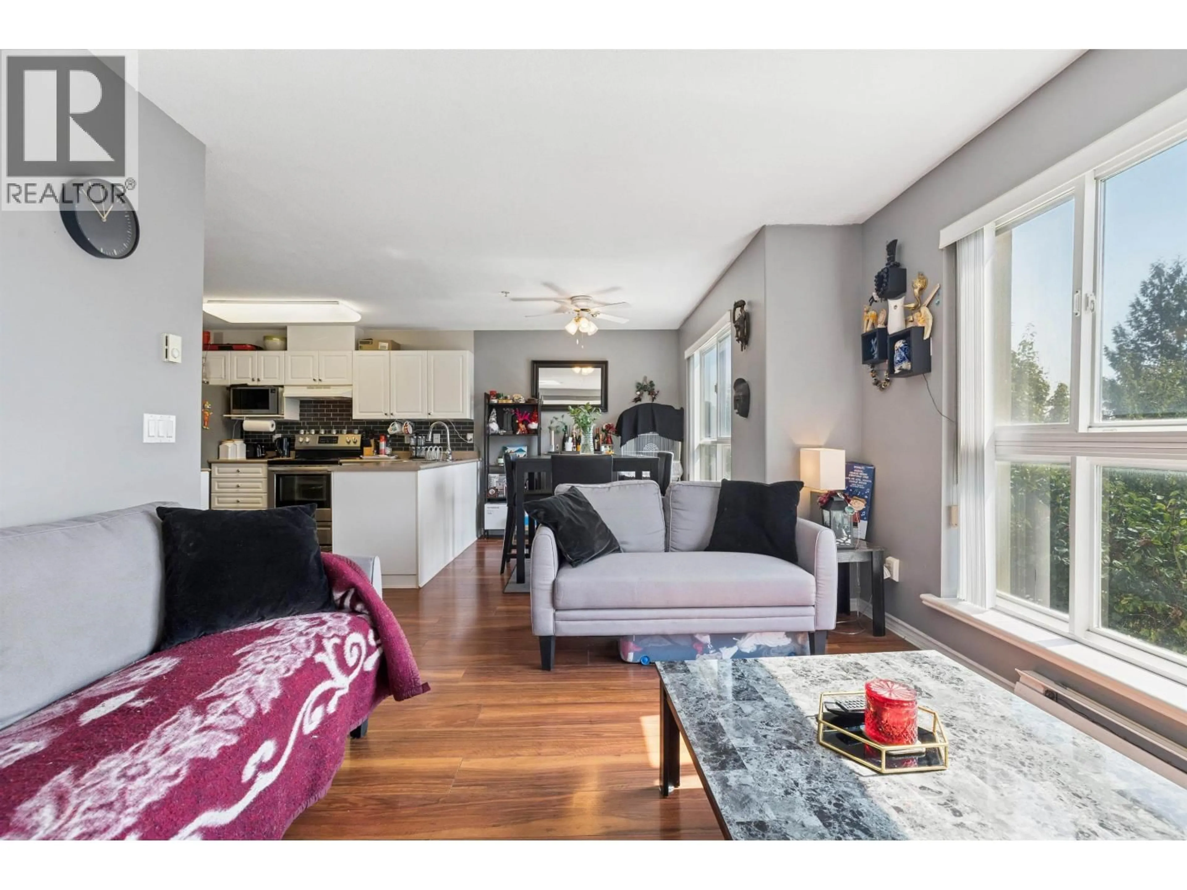 Living room with furniture, wood/laminate floor for 405 - 22230 NORTH AVENUE, Maple Ridge British Columbia V2X2L5