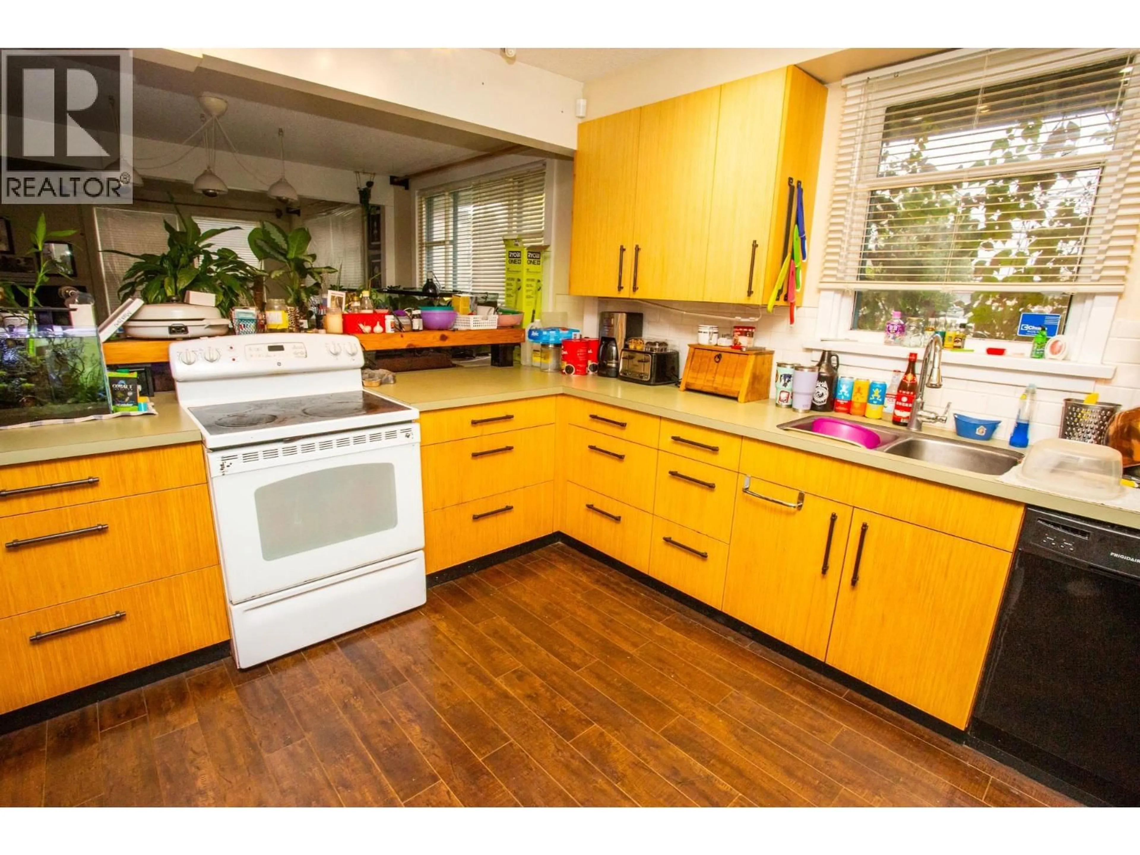 Open concept kitchen, wood/laminate floor for 2021 SPRUCE STREET, Prince George British Columbia V2L2R7