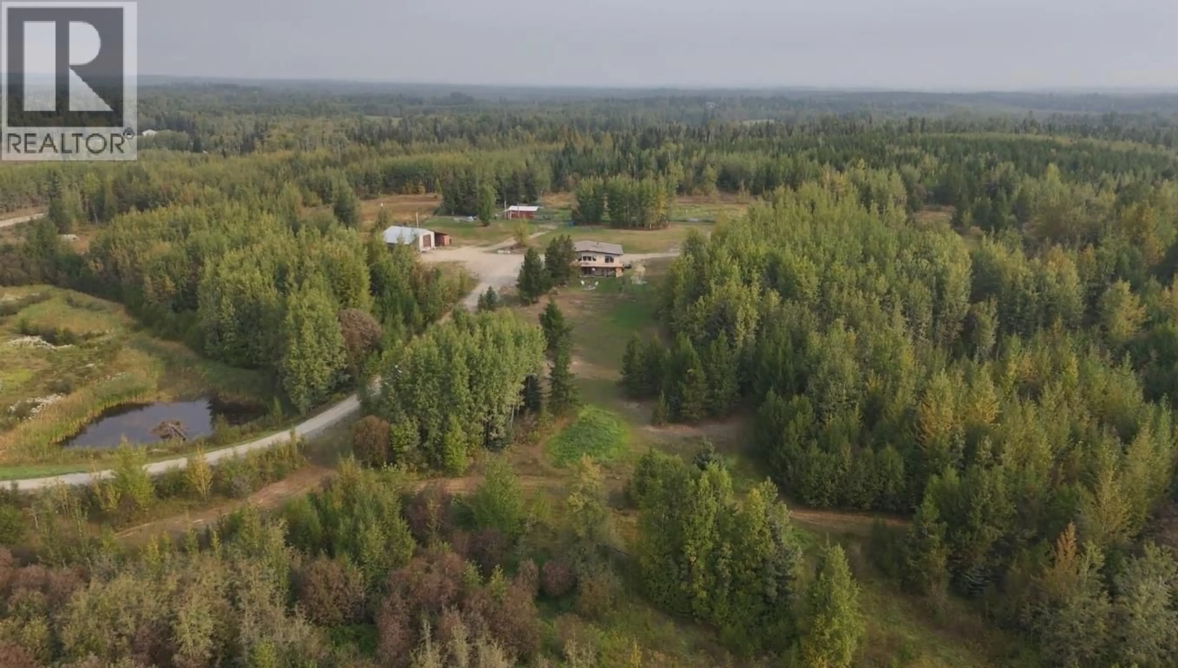 A pic from outside/outdoor area/front of a property/back of a property/a pic from drone, forest/trees view for 34380 CHIEF LAKE ROAD, Prince George British Columbia V2K5L6