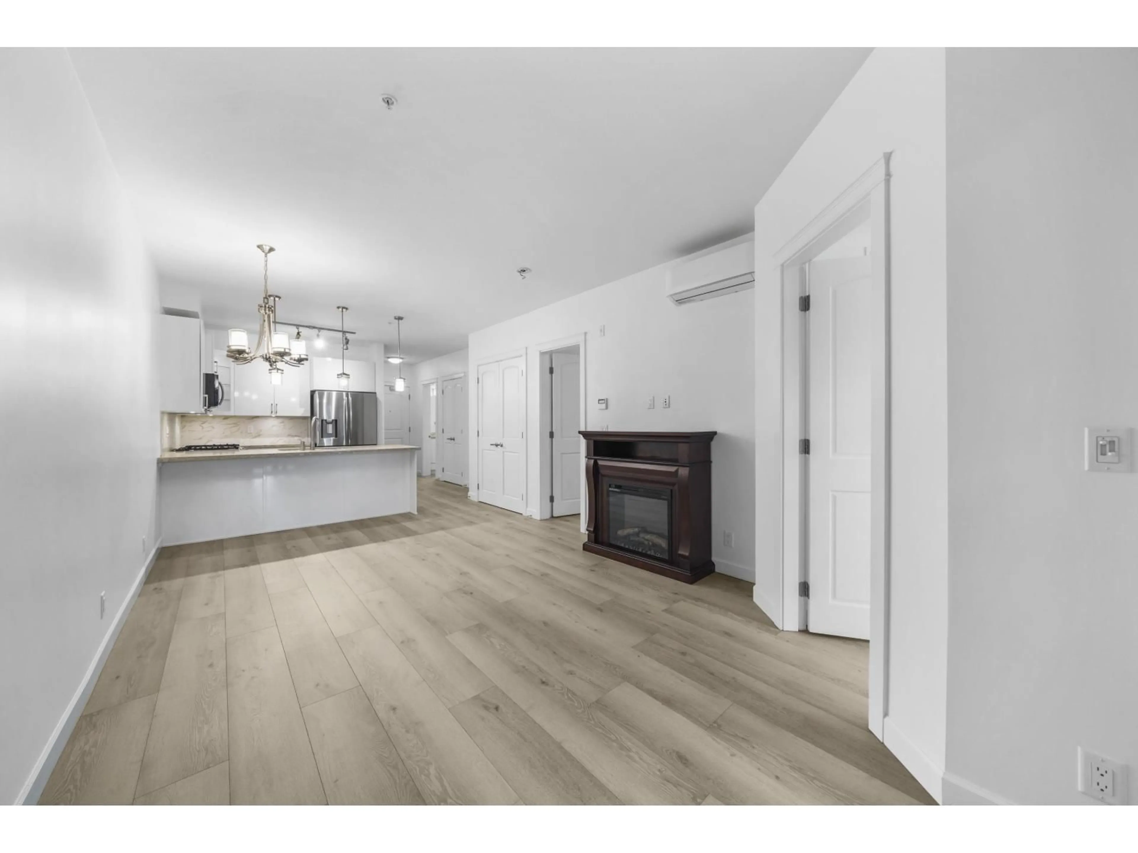 Open concept kitchen, wood/laminate floor for 202 - 20376 86, Langley British Columbia V2Y3P8