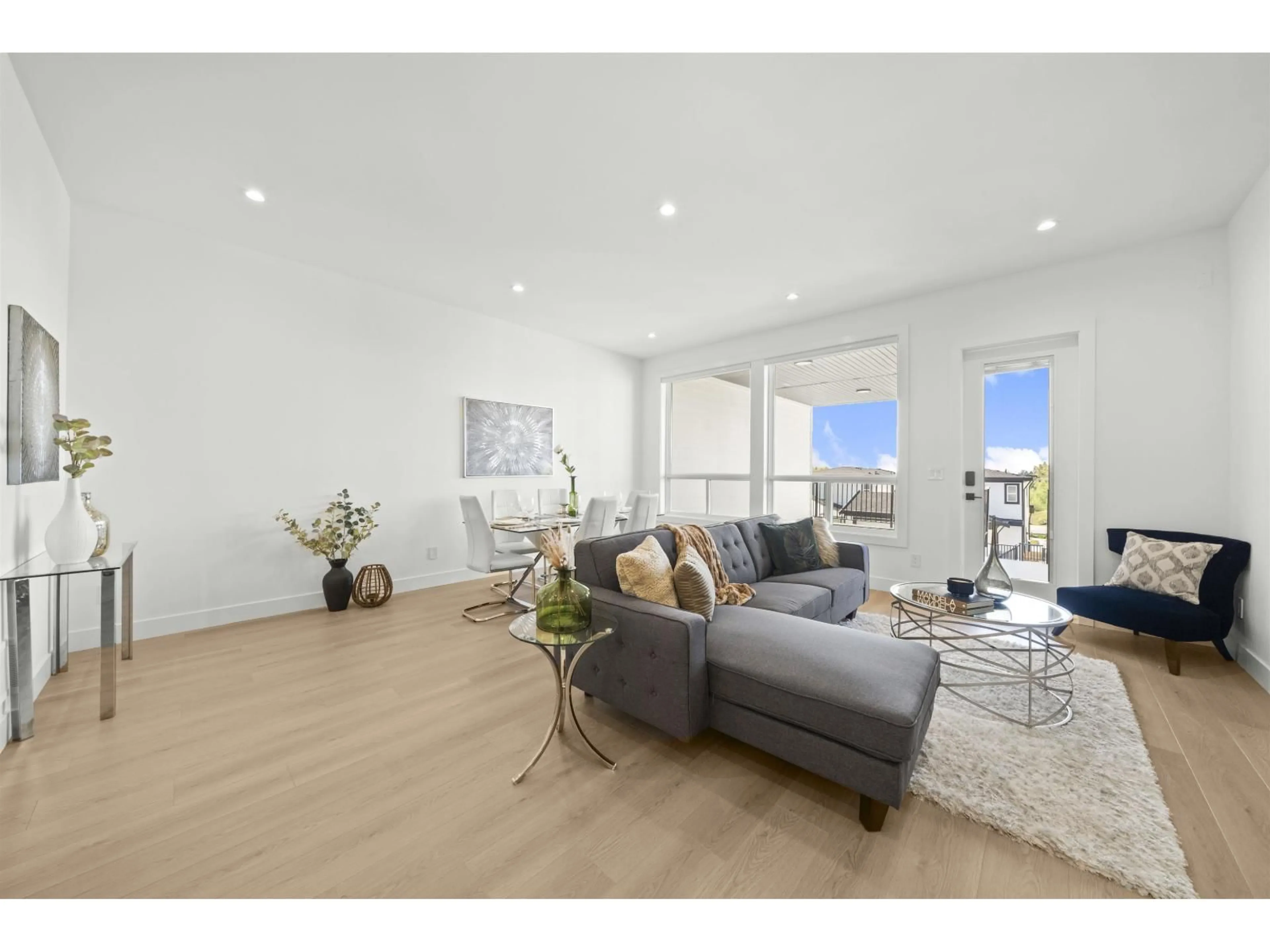 Living room with furniture, wood/laminate floor for 16722 16, Surrey British Columbia V3S9X7
