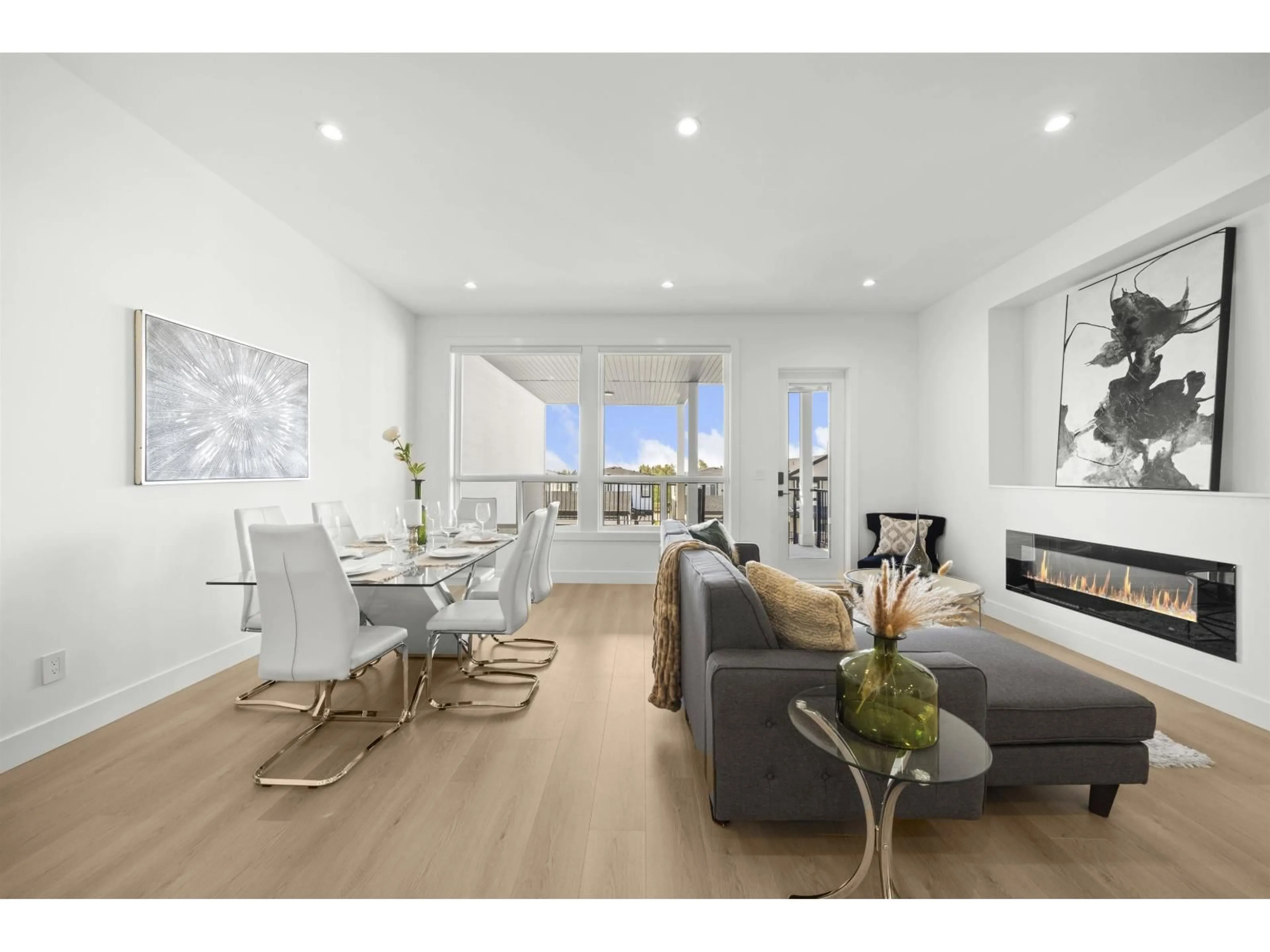 Living room with furniture, wood/laminate floor for 16722 16, Surrey British Columbia V3S9X7