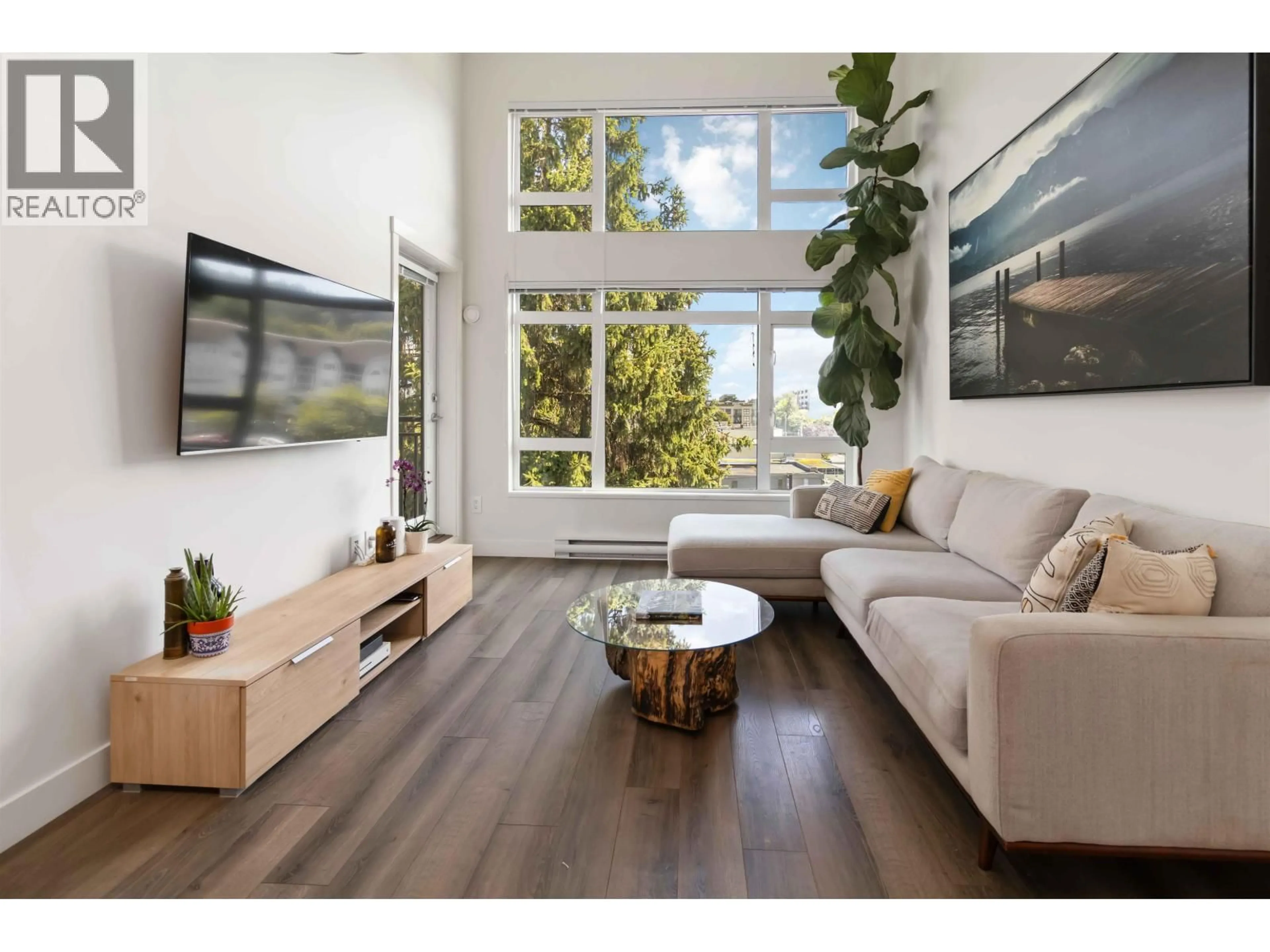Living room with furniture, wood/laminate floor for 515 - 2525 CLARKE STREET, Port Moody British Columbia V3H0J3