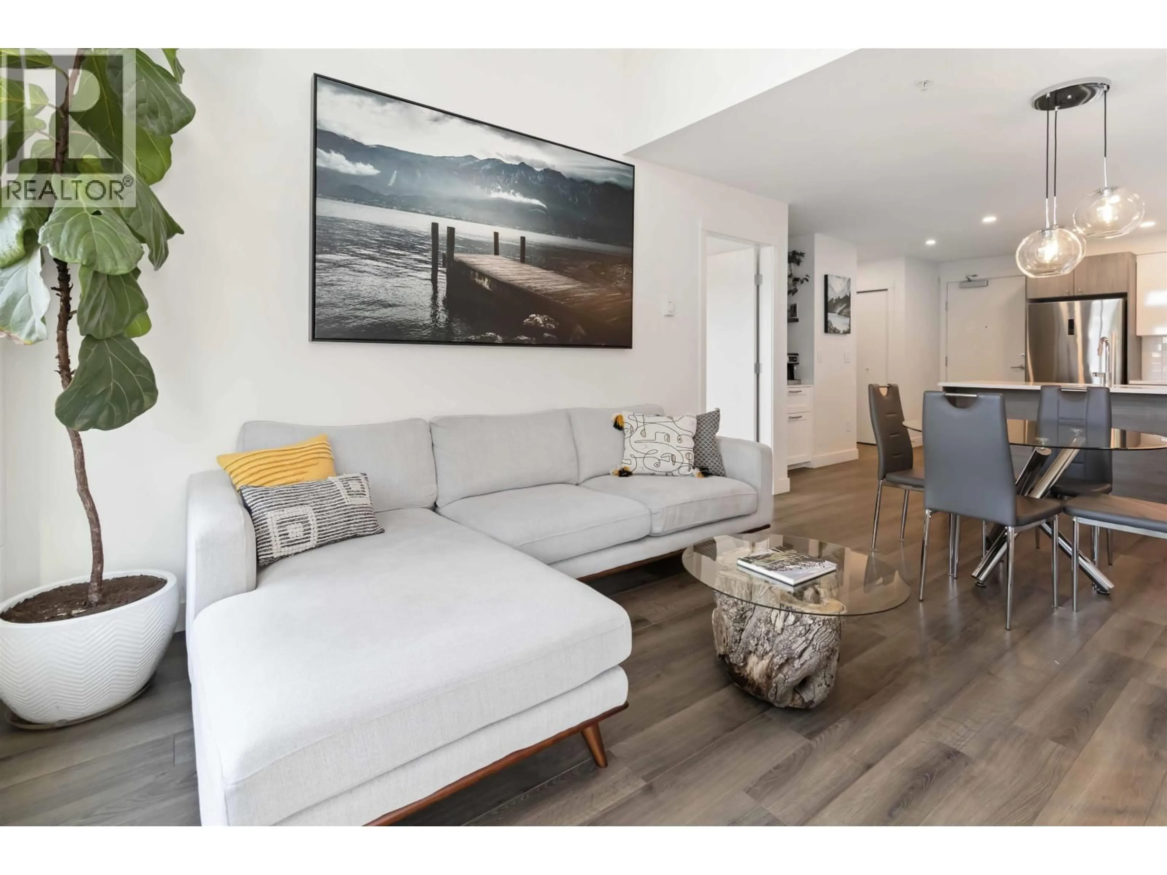 Living room with furniture, wood/laminate floor for 515 - 2525 CLARKE STREET, Port Moody British Columbia V3H0J3