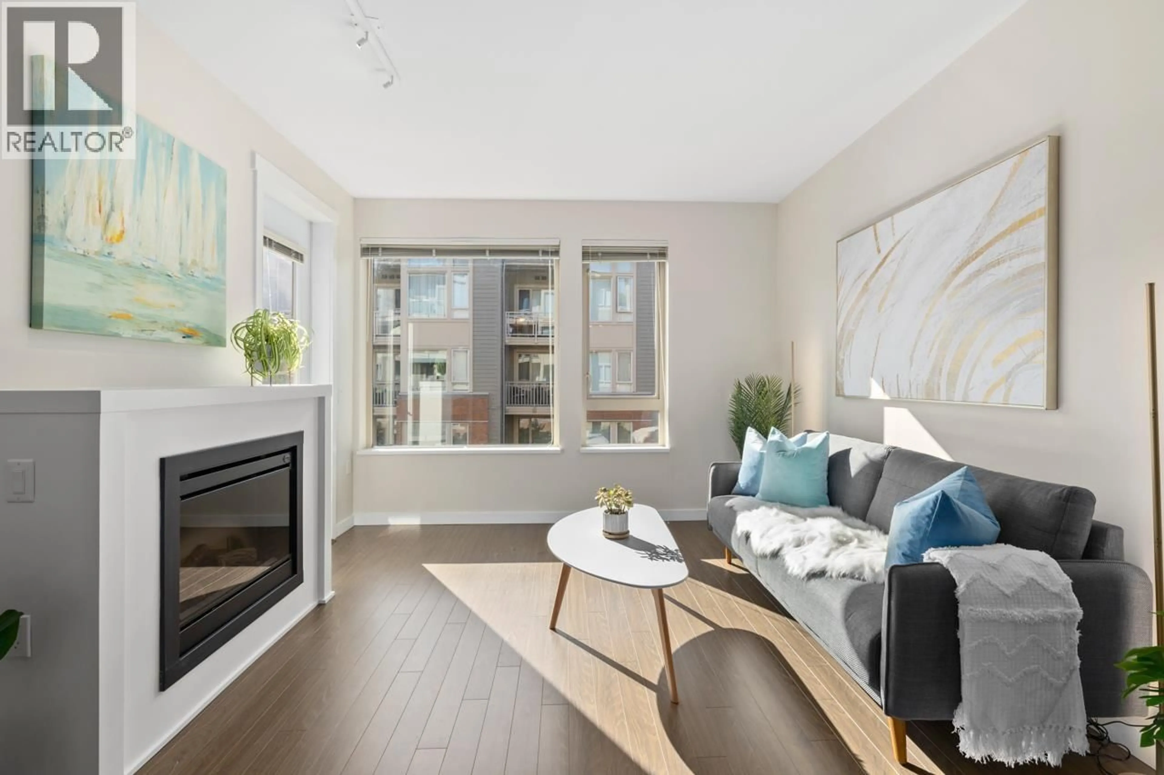 Living room with furniture, wood/laminate floor for 310 - 119 22ND STREET, North Vancouver British Columbia V7M0B4