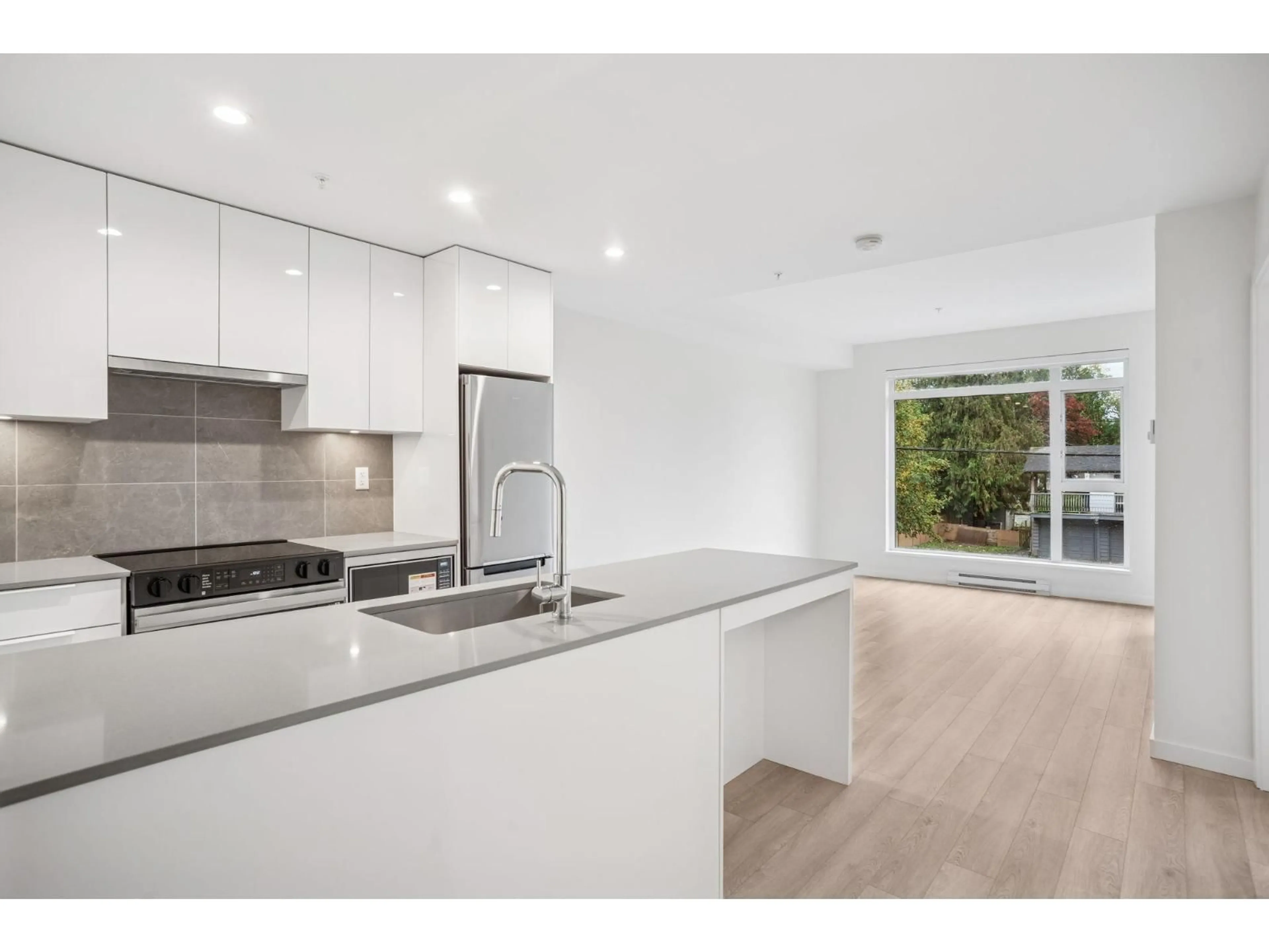 Open concept kitchen, unknown for 208 - 14257 103A AVENUE, Surrey British Columbia V3T1T1