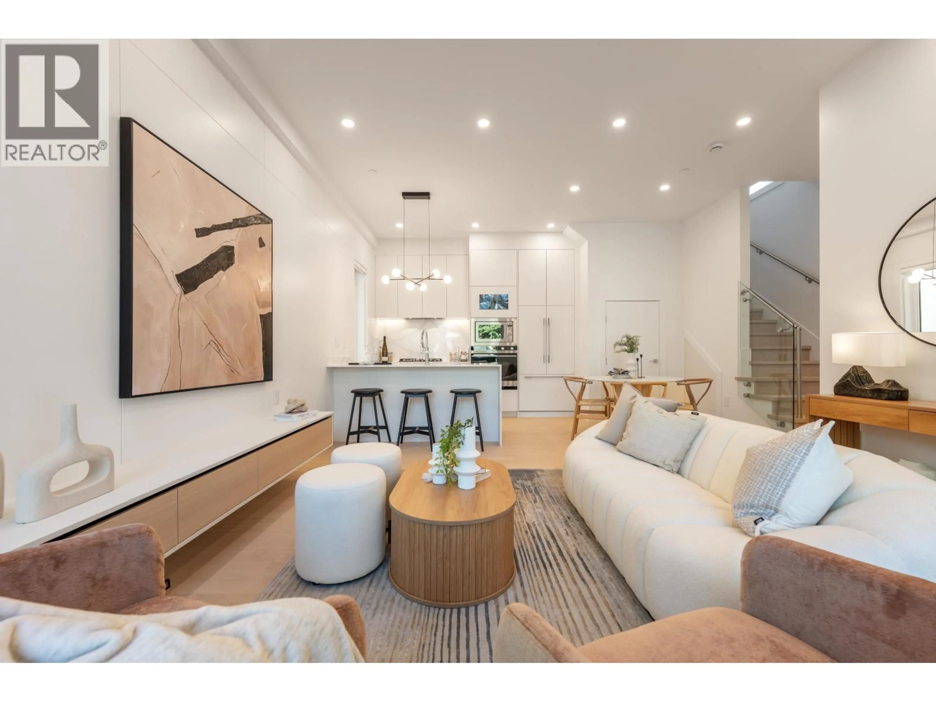 Living room with furniture, wood/laminate floor for 1 - 6933 PRINCE EDWARD STREET, Vancouver British Columbia V5X3P2
