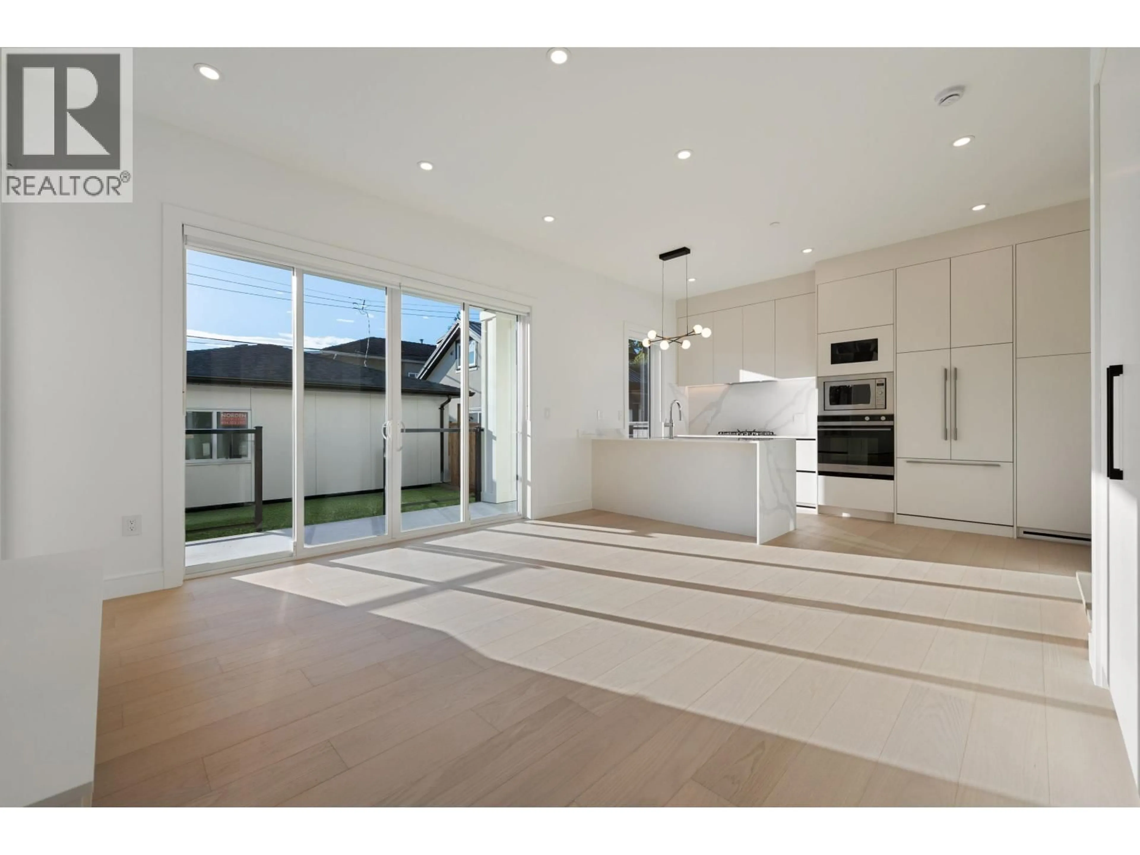 Open concept kitchen, ceramic/tile floor for 2 - 6933 PRINCE EDWARD STREET, Vancouver British Columbia V5X3P2