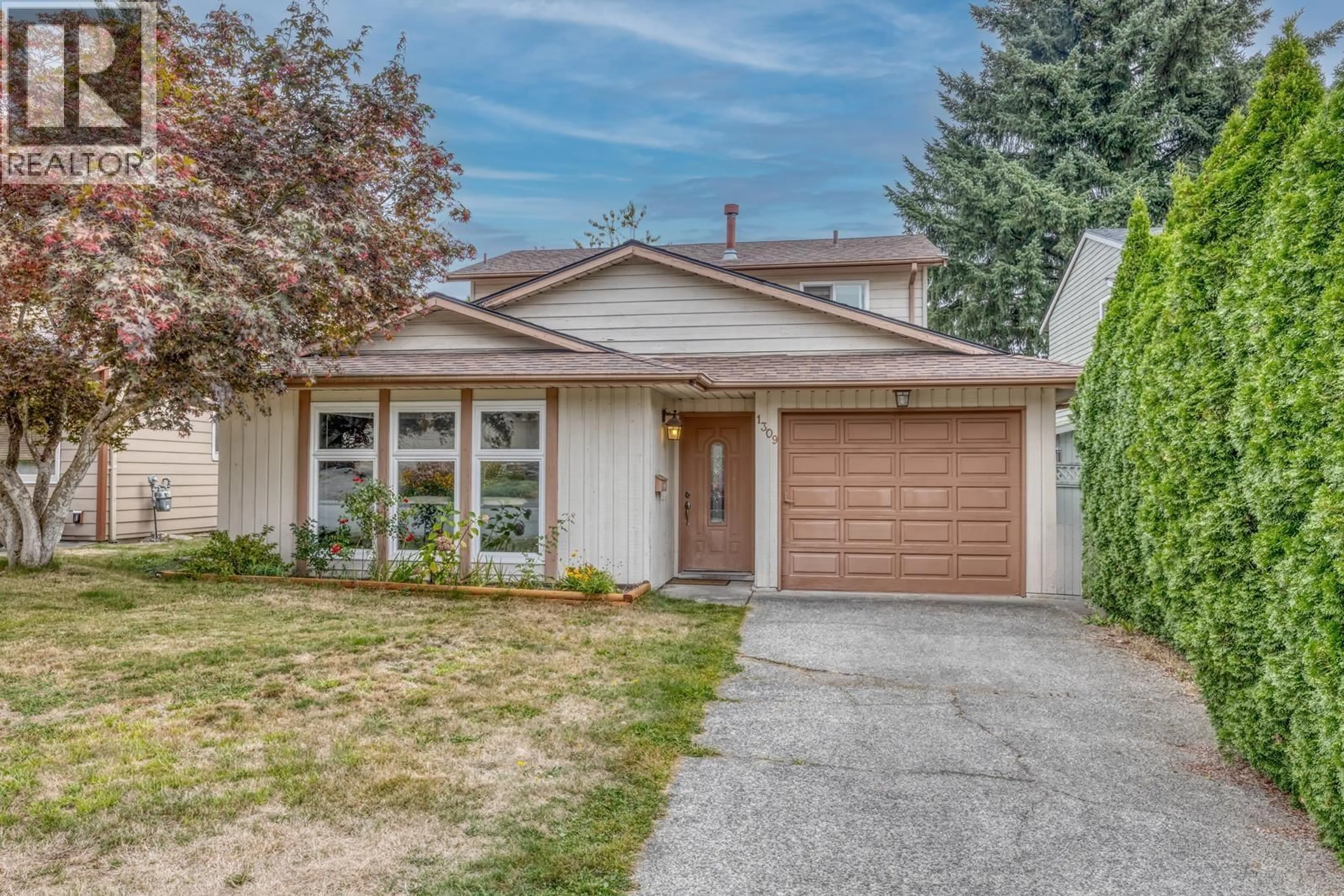 Home with vinyl exterior material, street for 1309 NESTOR STREET, Coquitlam British Columbia V3E1V5