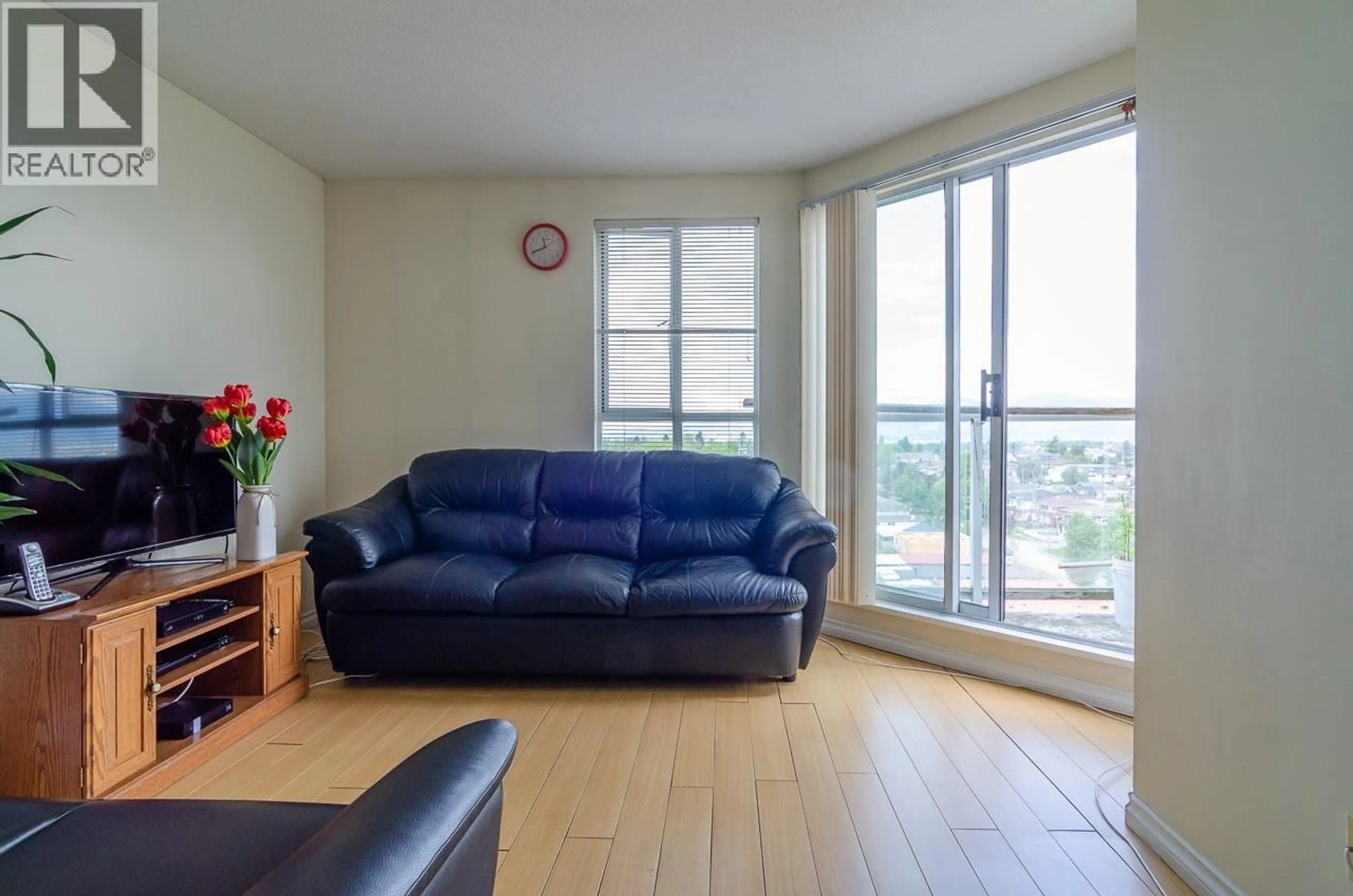 Living room with furniture, wood/laminate floor for 1206 - 3455 ASCOT PLACE, Vancouver British Columbia V5R6B7