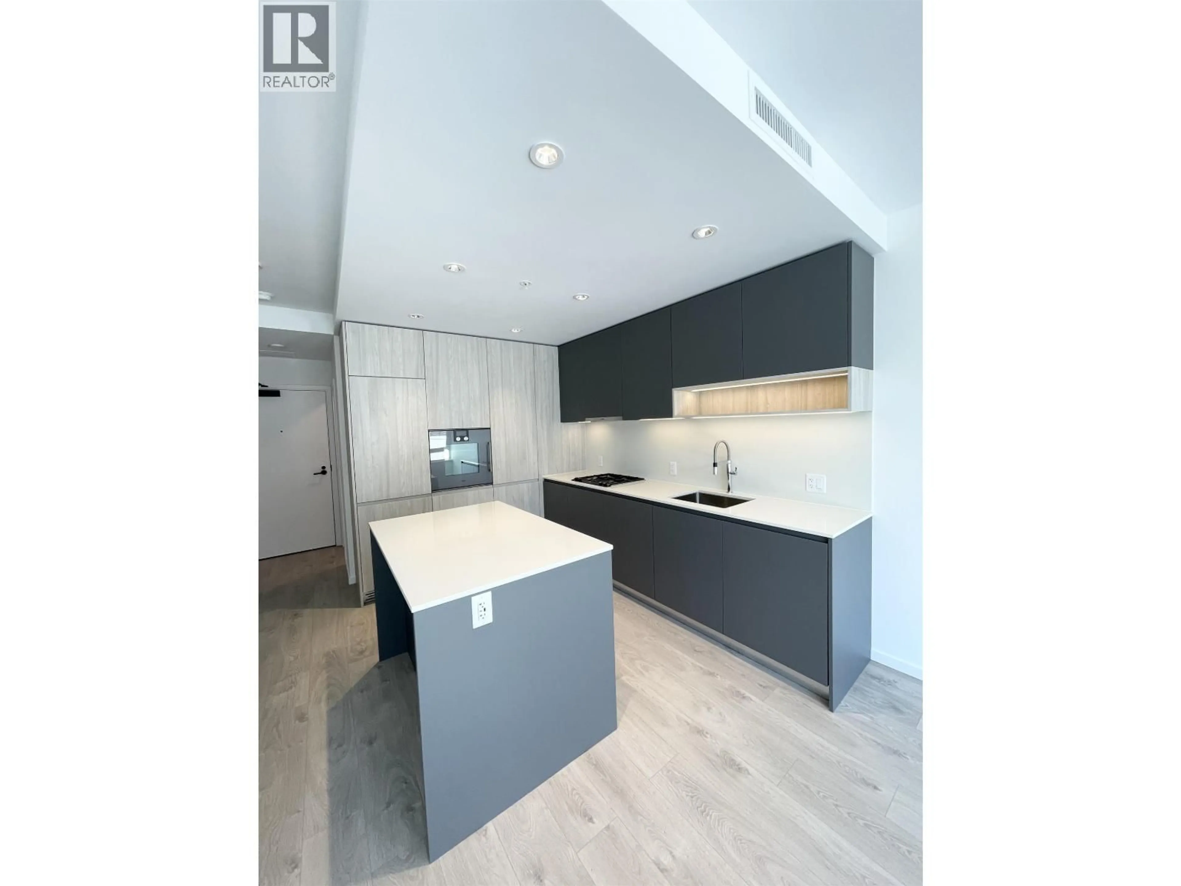 Open concept kitchen, wood/laminate floor for 216 - 6600 MINORU BOULEVARD, Richmond British Columbia V6Y0N3