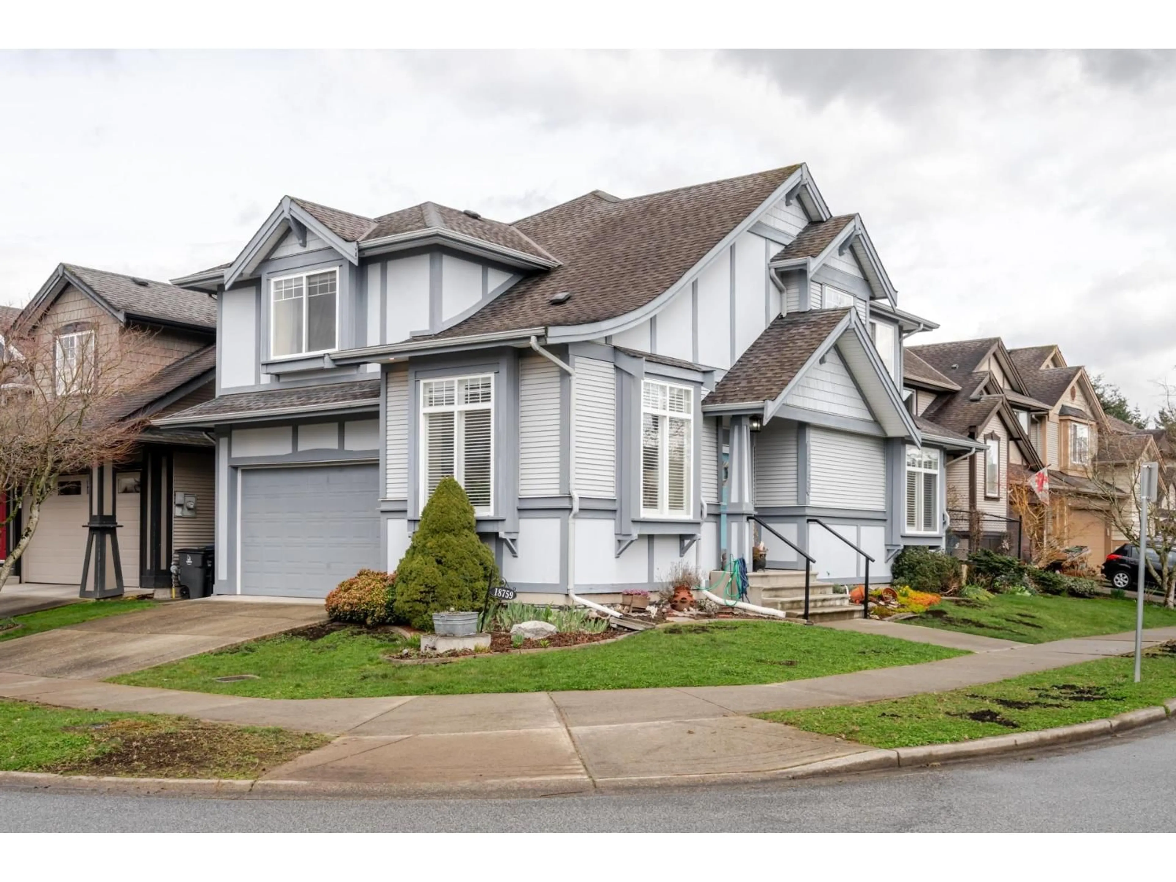 Home with vinyl exterior material, street for 18759 66, Surrey British Columbia V3S0T1