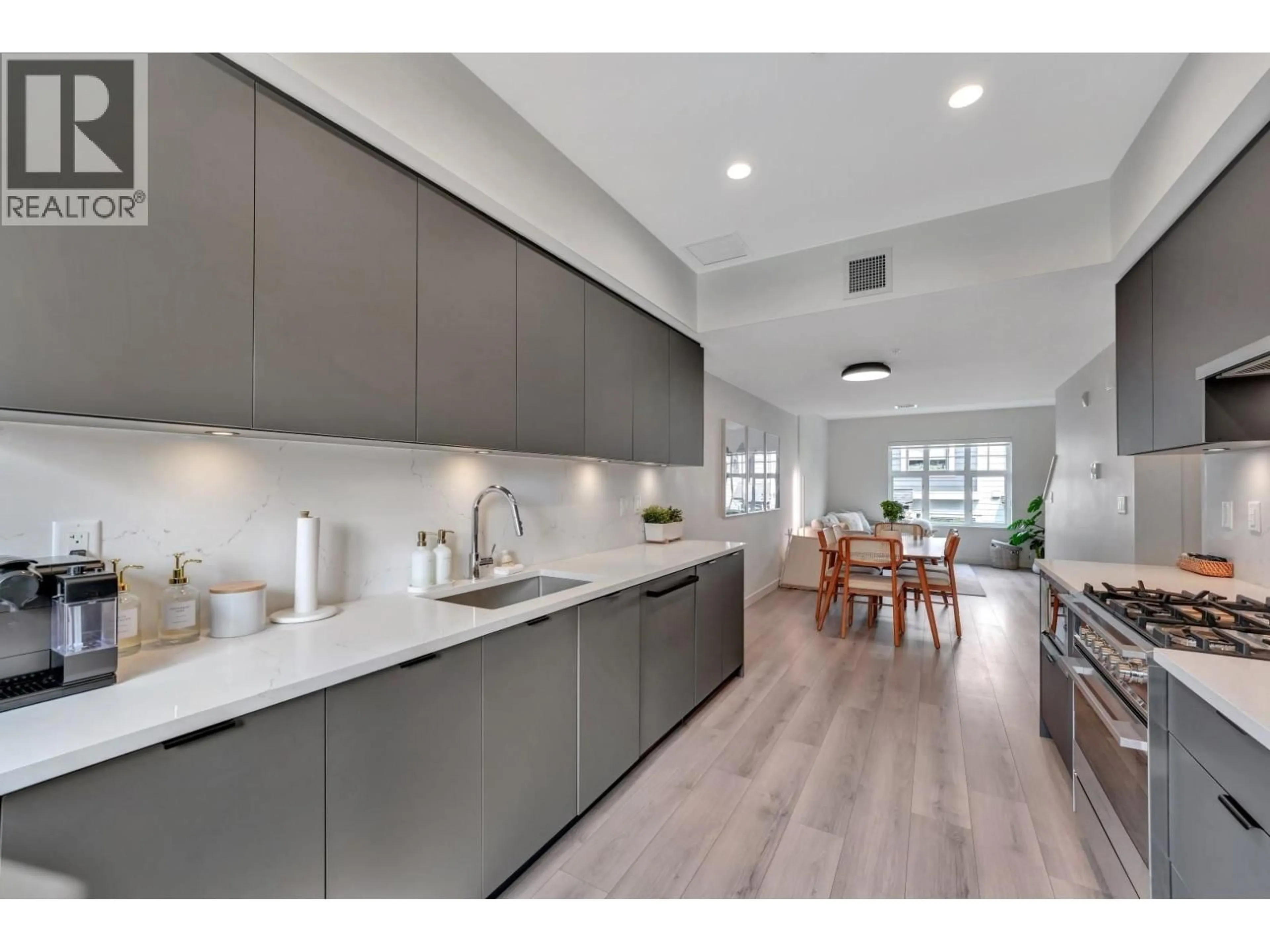 Open concept kitchen, ceramic/tile floor for 207 - 678 FAIRVIEW STREET, Coquitlam British Columbia V3J0N1