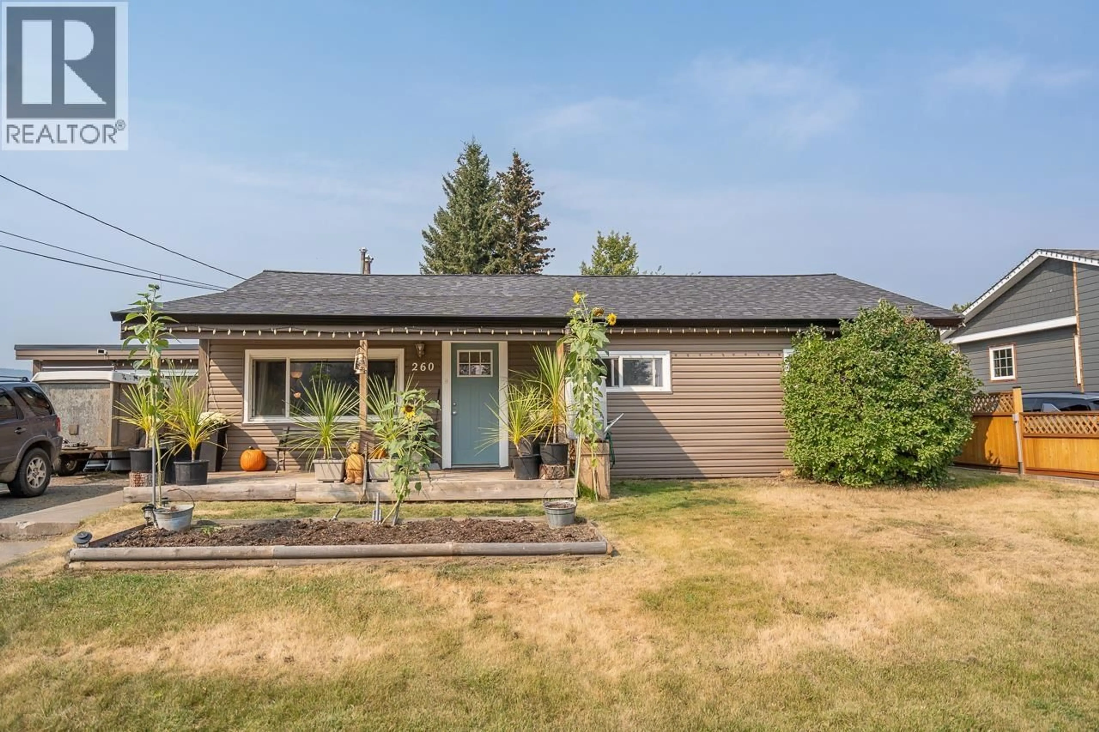 Home with vinyl exterior material, street for 260 DOGWOOD AVENUE, 100 Mile House British Columbia V0K2E0