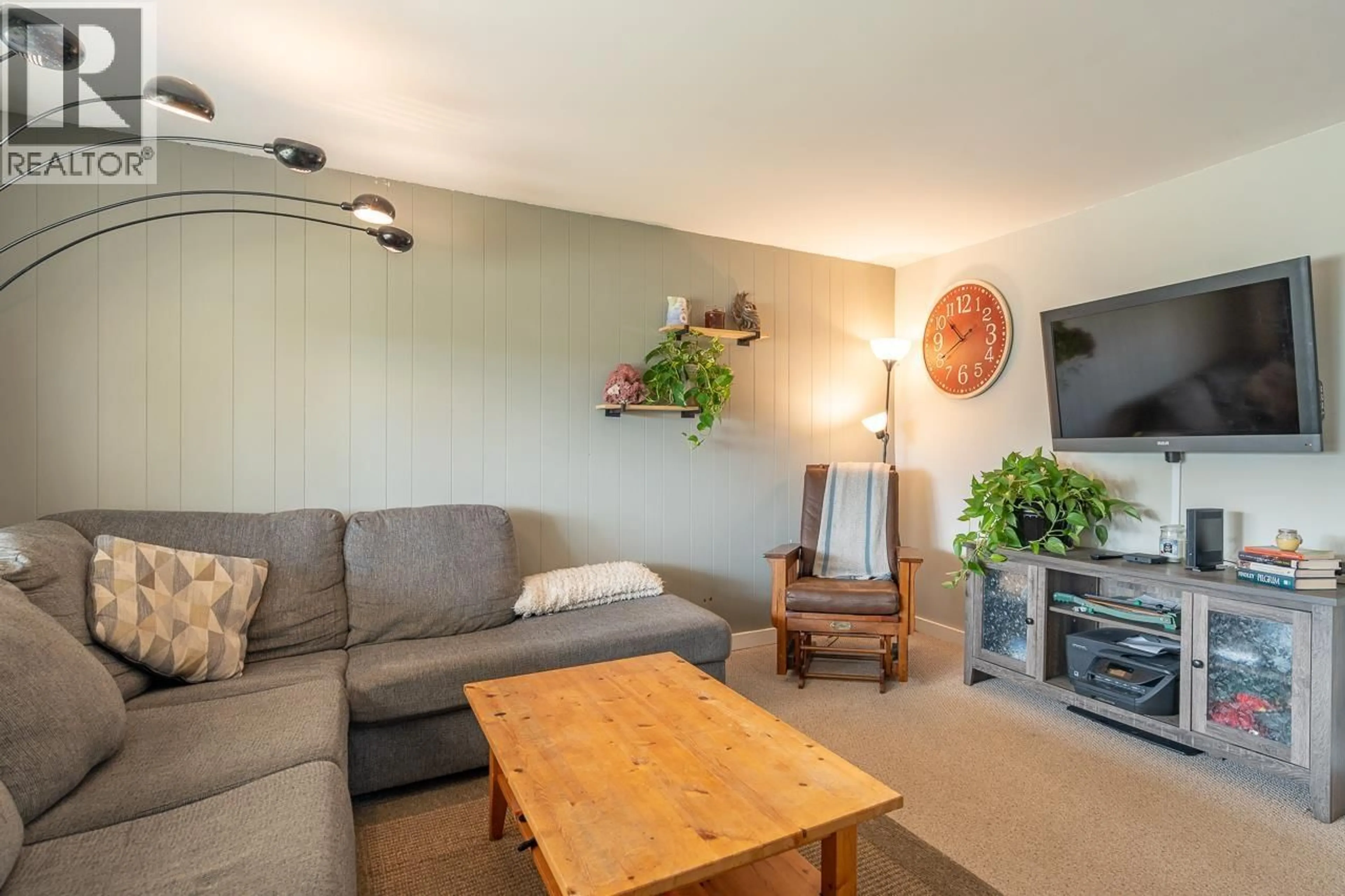 Living room with furniture, wood/laminate floor for 260 DOGWOOD AVENUE, 100 Mile House British Columbia V0K2E0