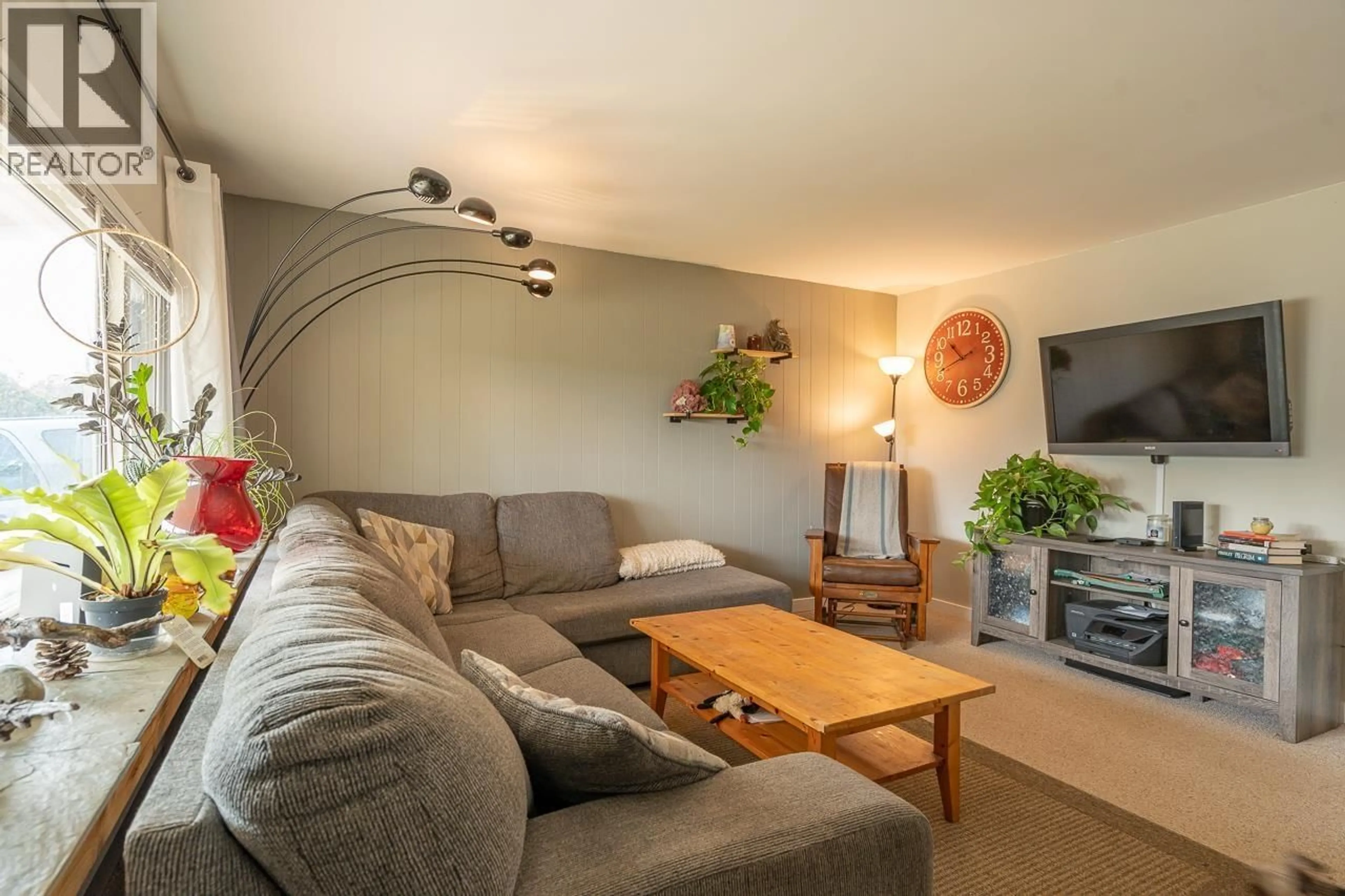 Living room with furniture, wood/laminate floor for 260 DOGWOOD AVENUE, 100 Mile House British Columbia V0K2E0