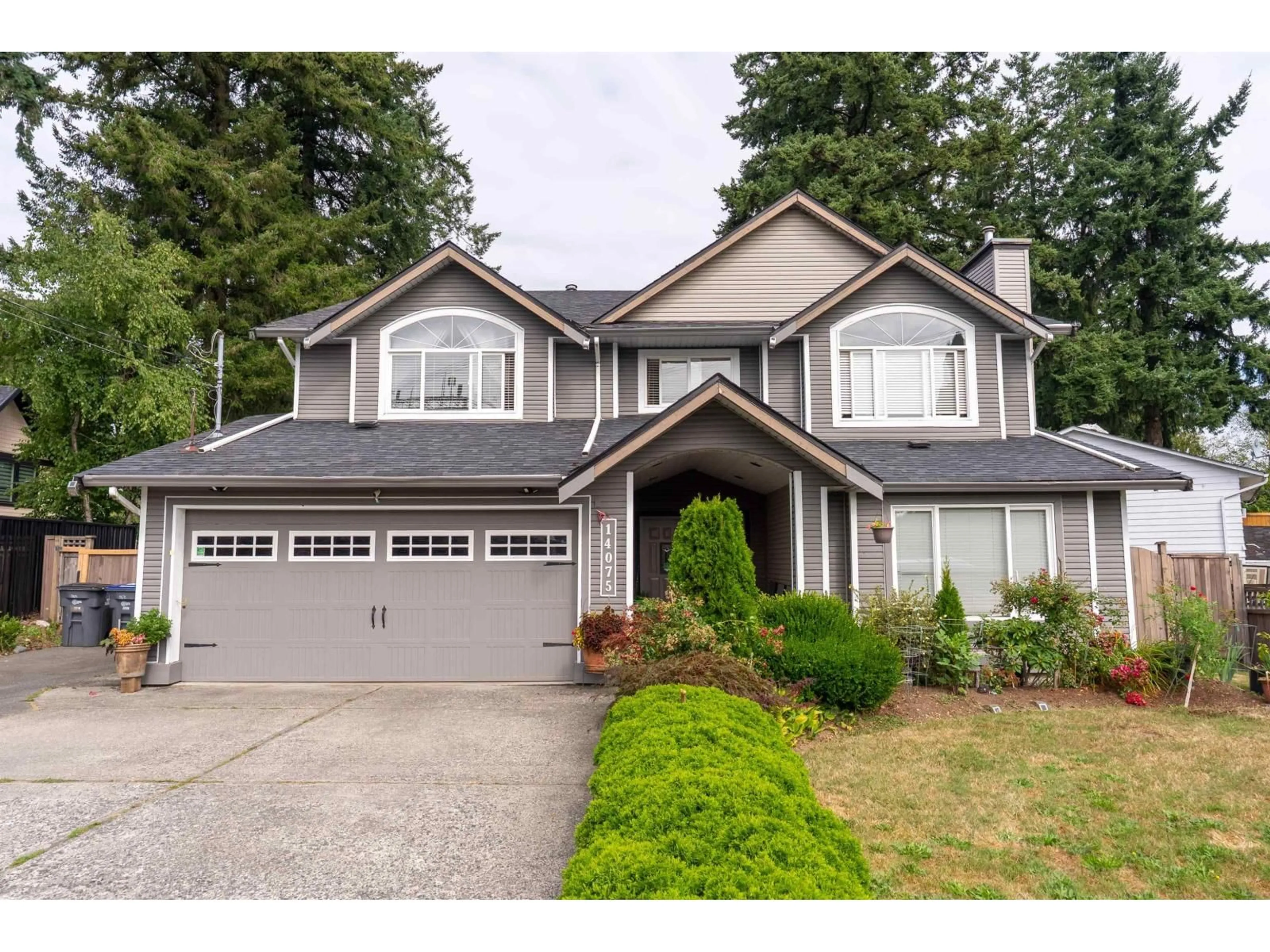 Home with vinyl exterior material, street for 14075 110A, Surrey British Columbia V3R2B2