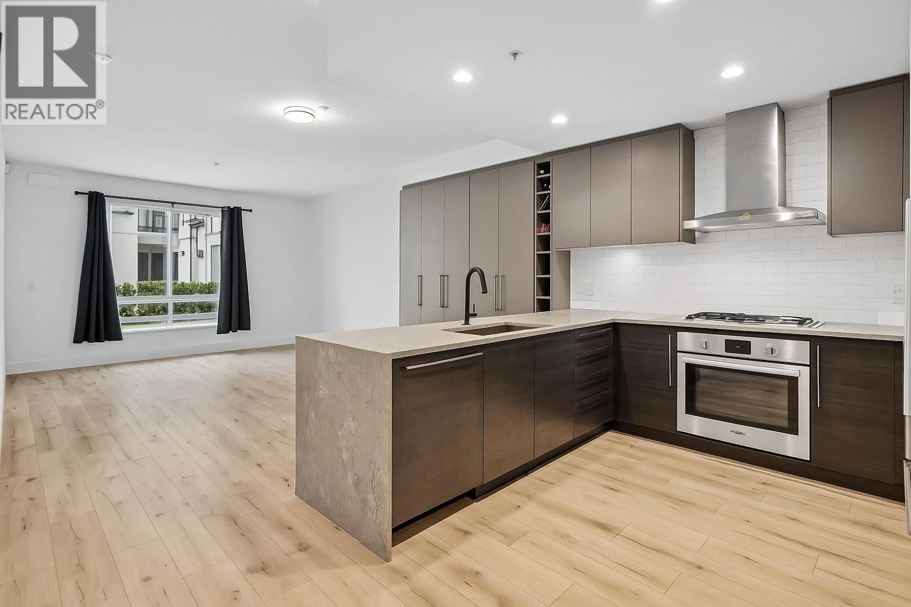 Open concept kitchen, wood/laminate floor for 225 - 3131 MURRAY STREET, Port Moody British Columbia V3H0L9