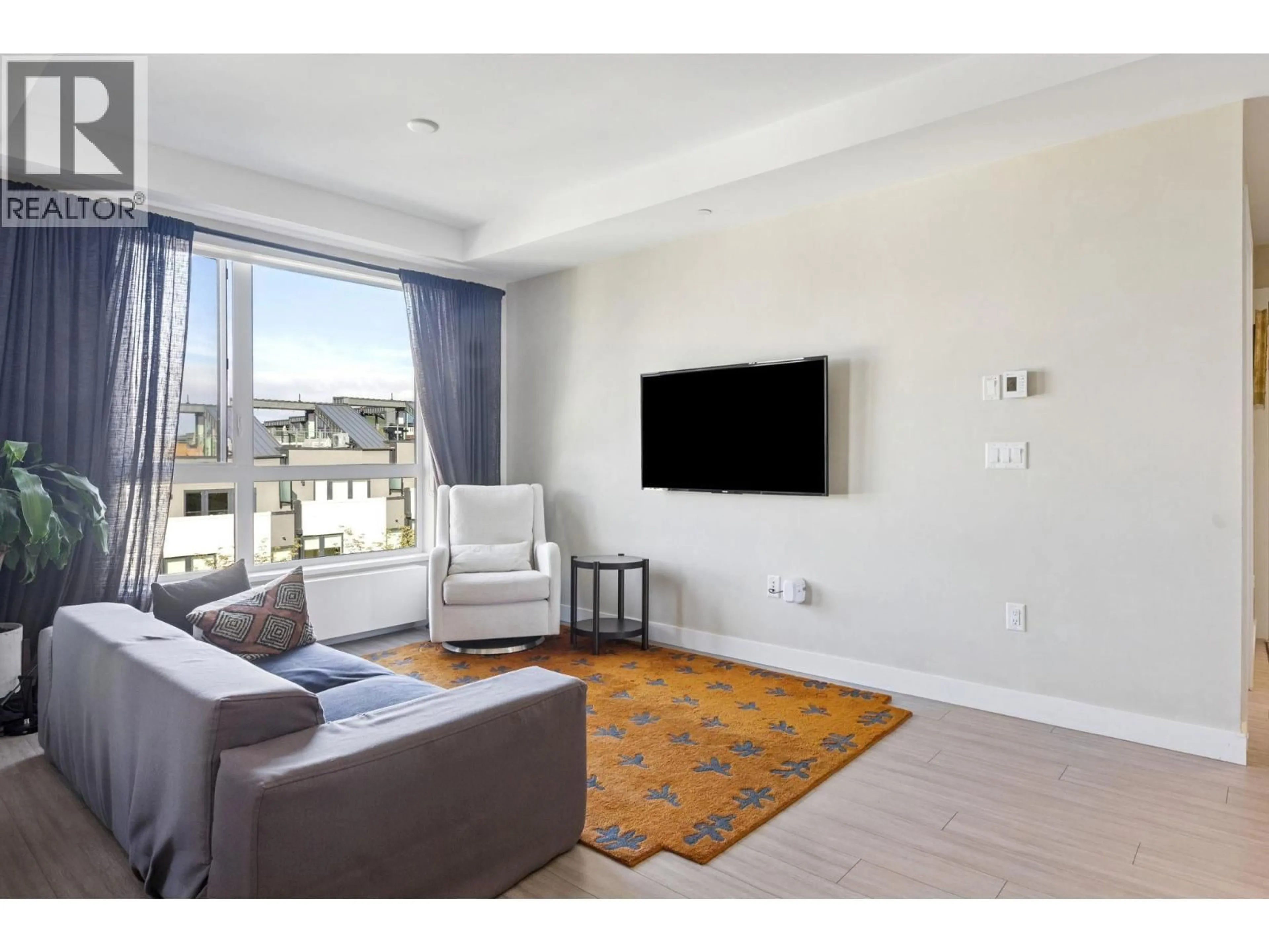 Living room with furniture, unknown for 303 - 707 3 STREET, North Vancouver British Columbia V7L1G8