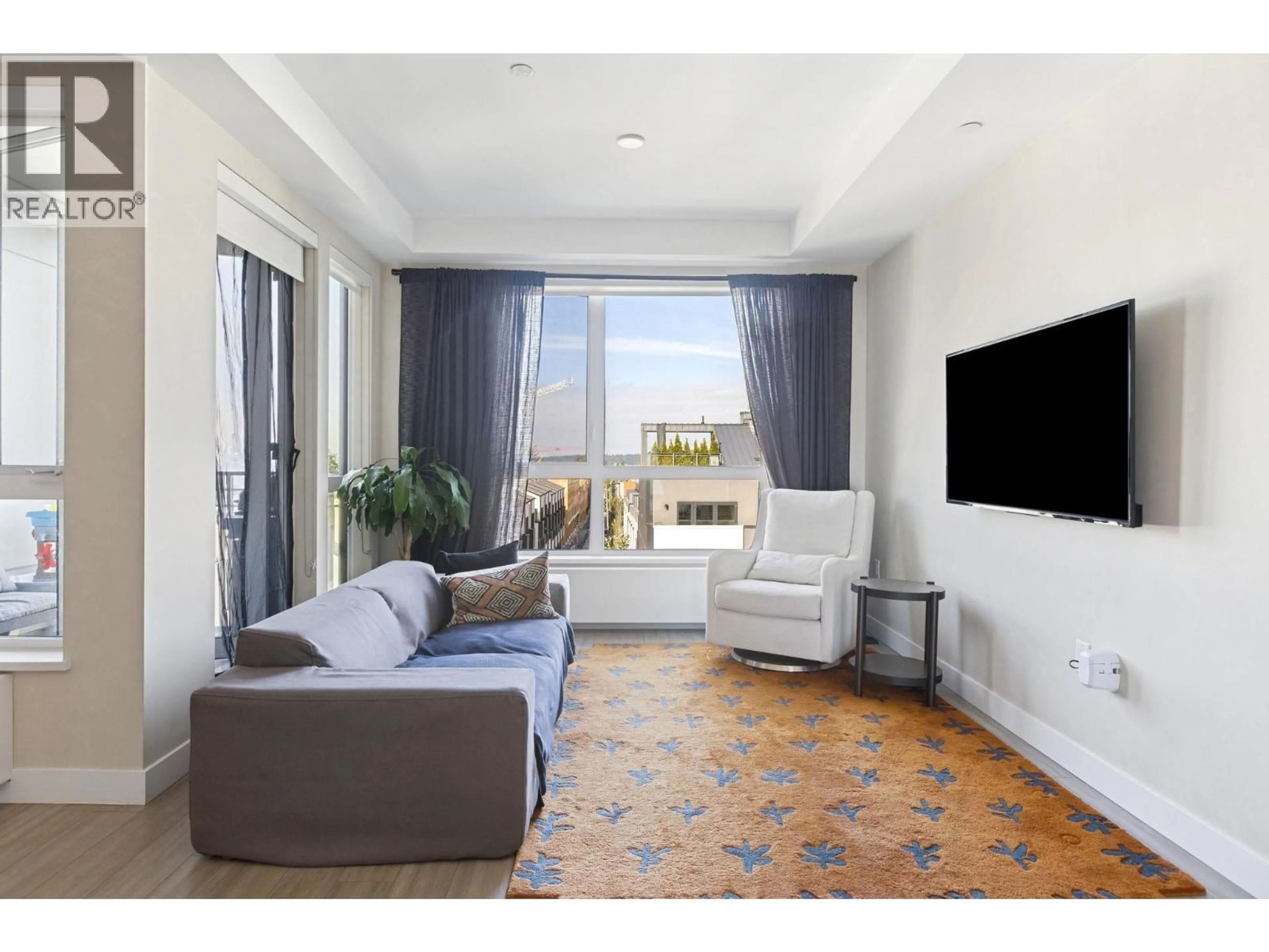 Living room with furniture, unknown for 303 - 707 3 STREET, North Vancouver British Columbia V7L1G8