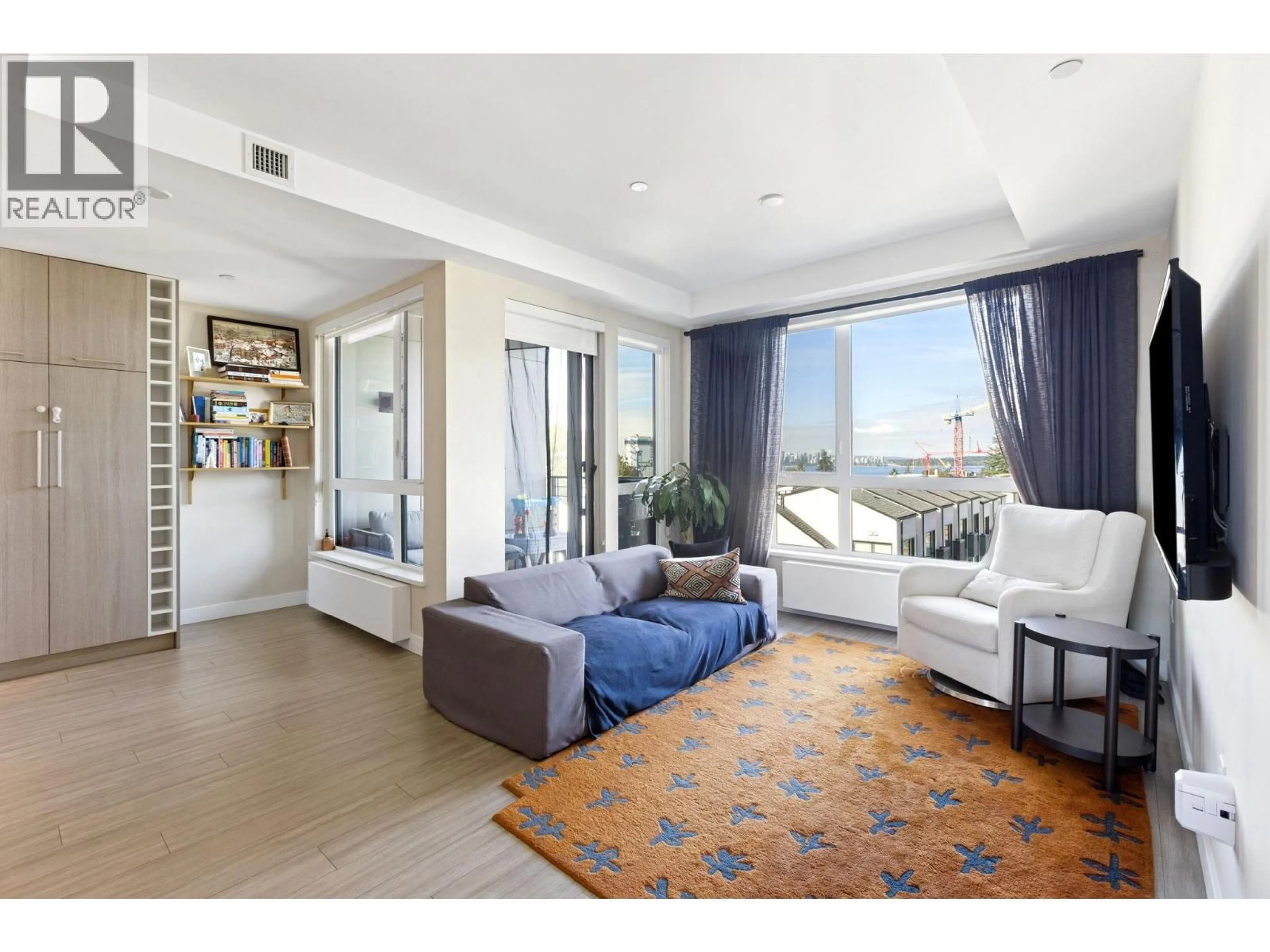 Living room with furniture, unknown for 303 - 707 3 STREET, North Vancouver British Columbia V7L1G8