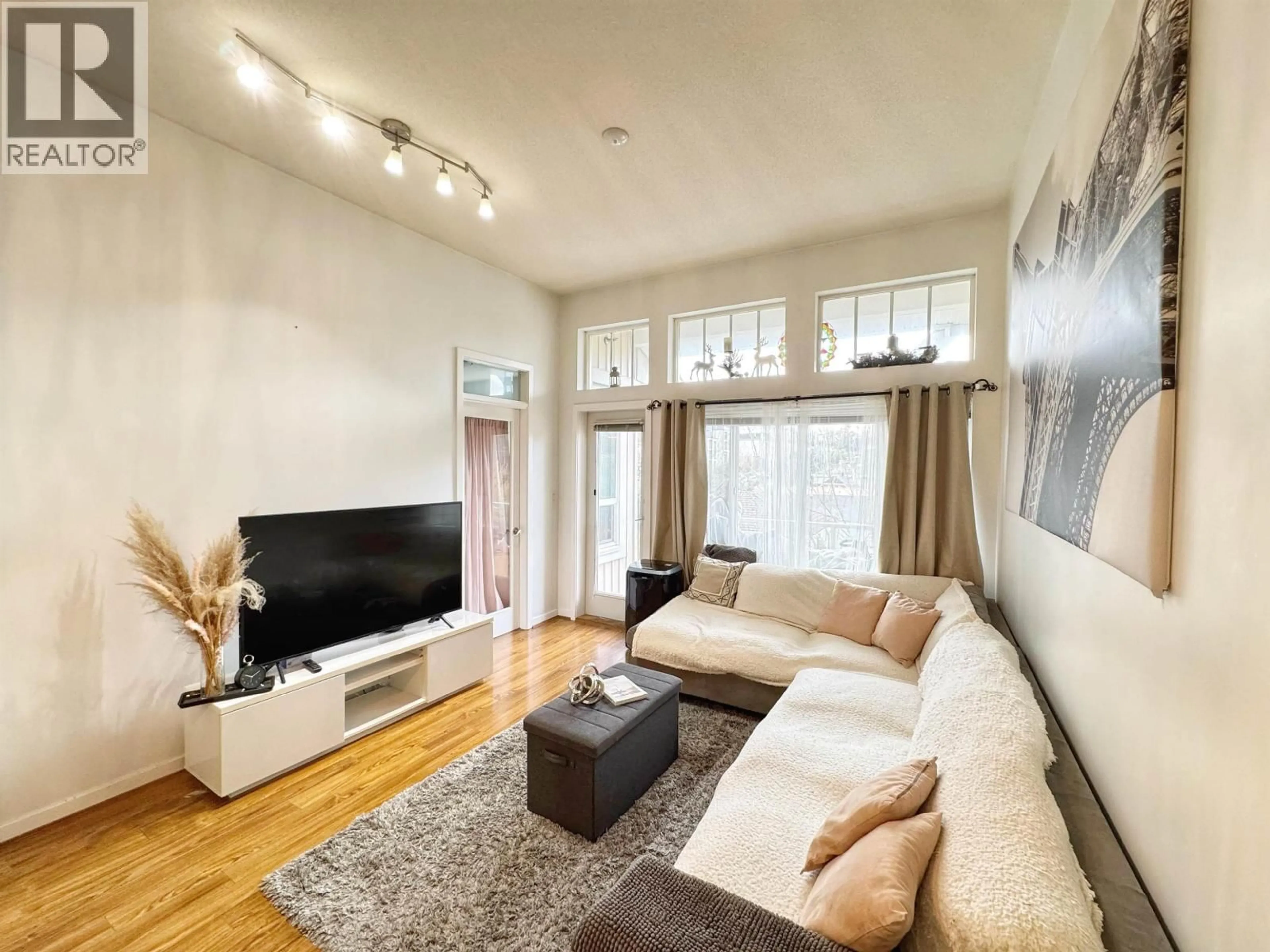 Living room with furniture, wood/laminate floor for 415 - 3651 FOSTER AVENUE, Vancouver British Columbia V5R0A2