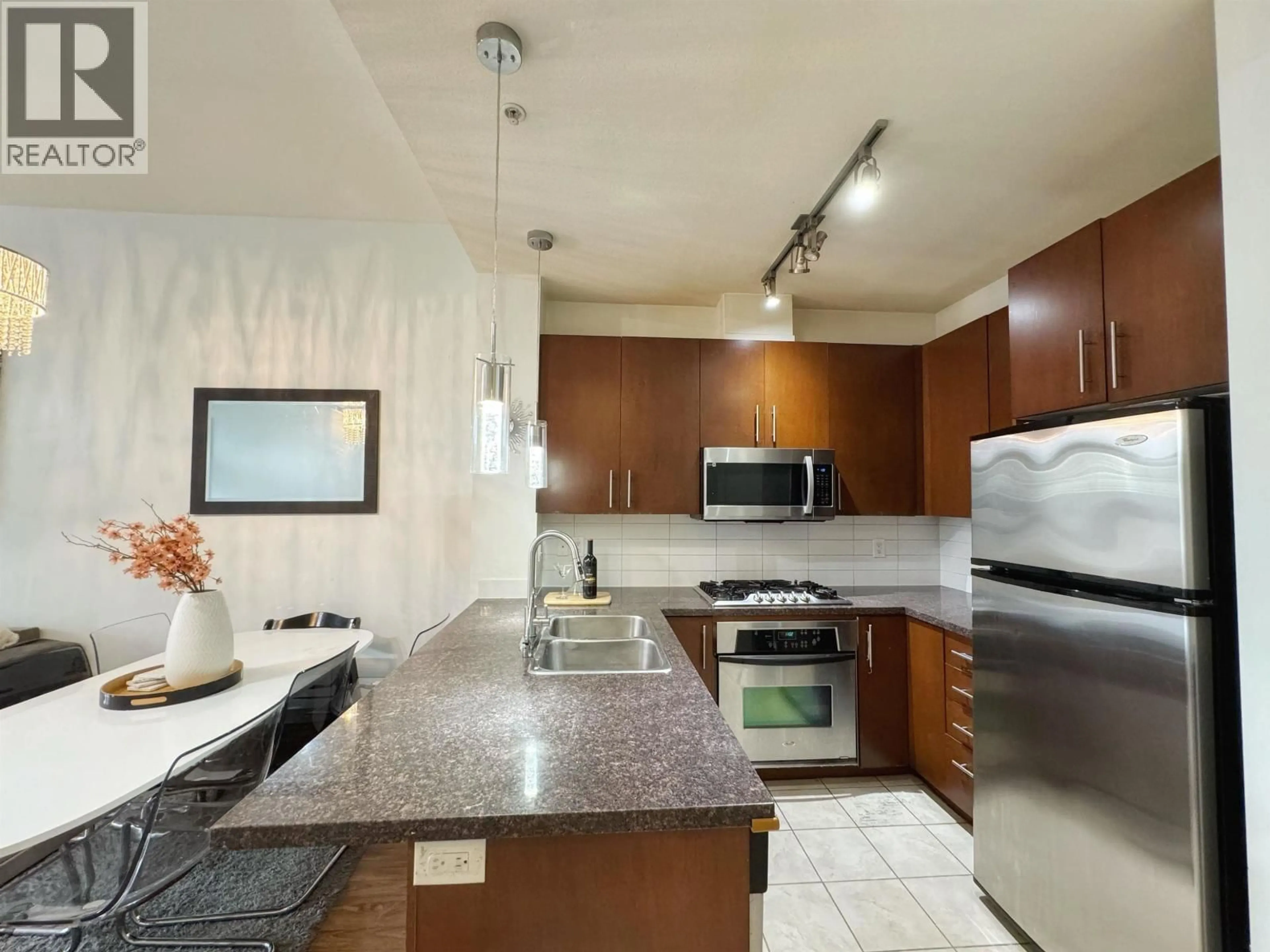 Open concept kitchen, ceramic/tile floor for 415 - 3651 FOSTER AVENUE, Vancouver British Columbia V5R0A2