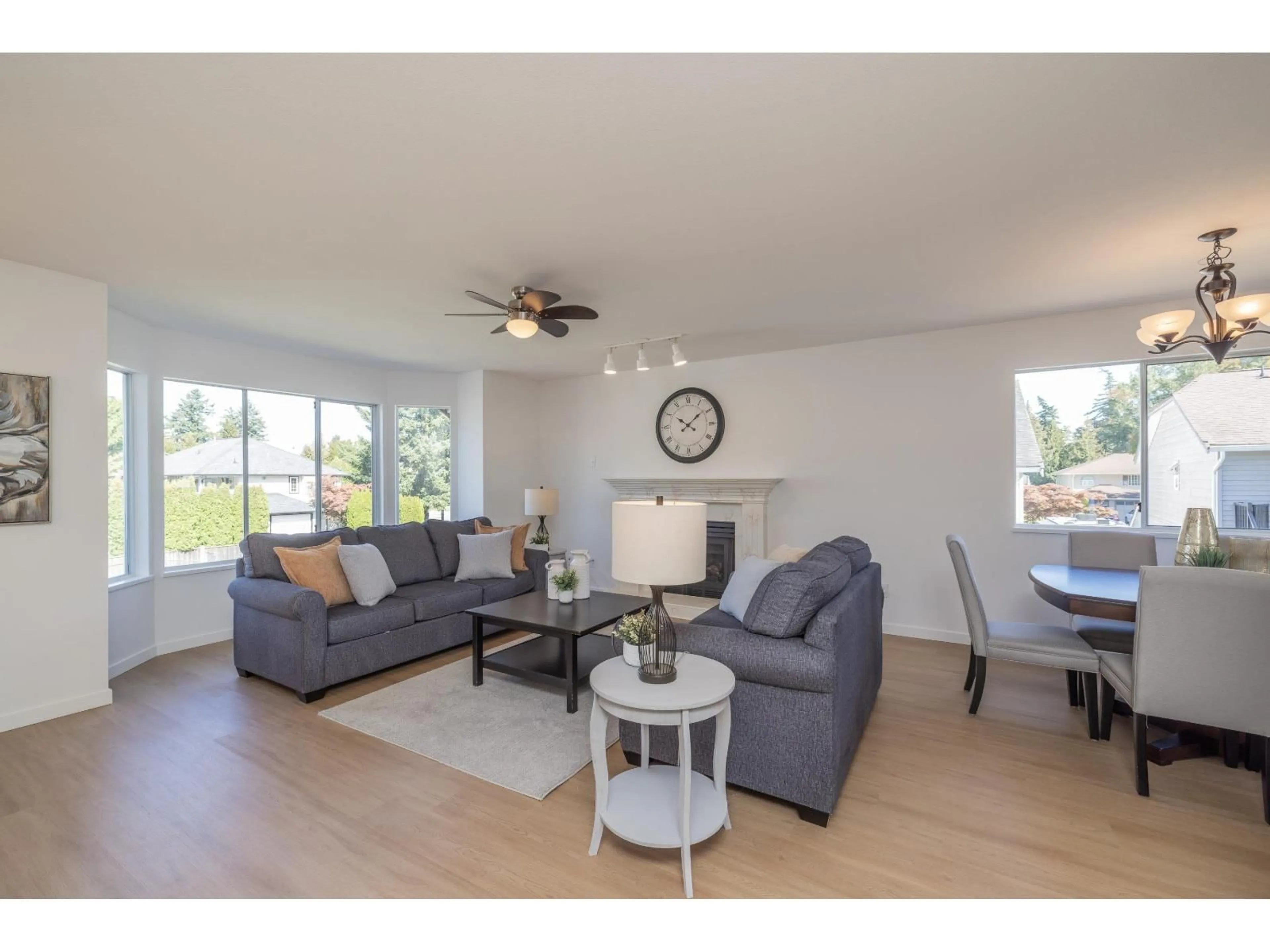 Living room with furniture, wood/laminate floor for 18638 59, Surrey British Columbia V3S7Z8